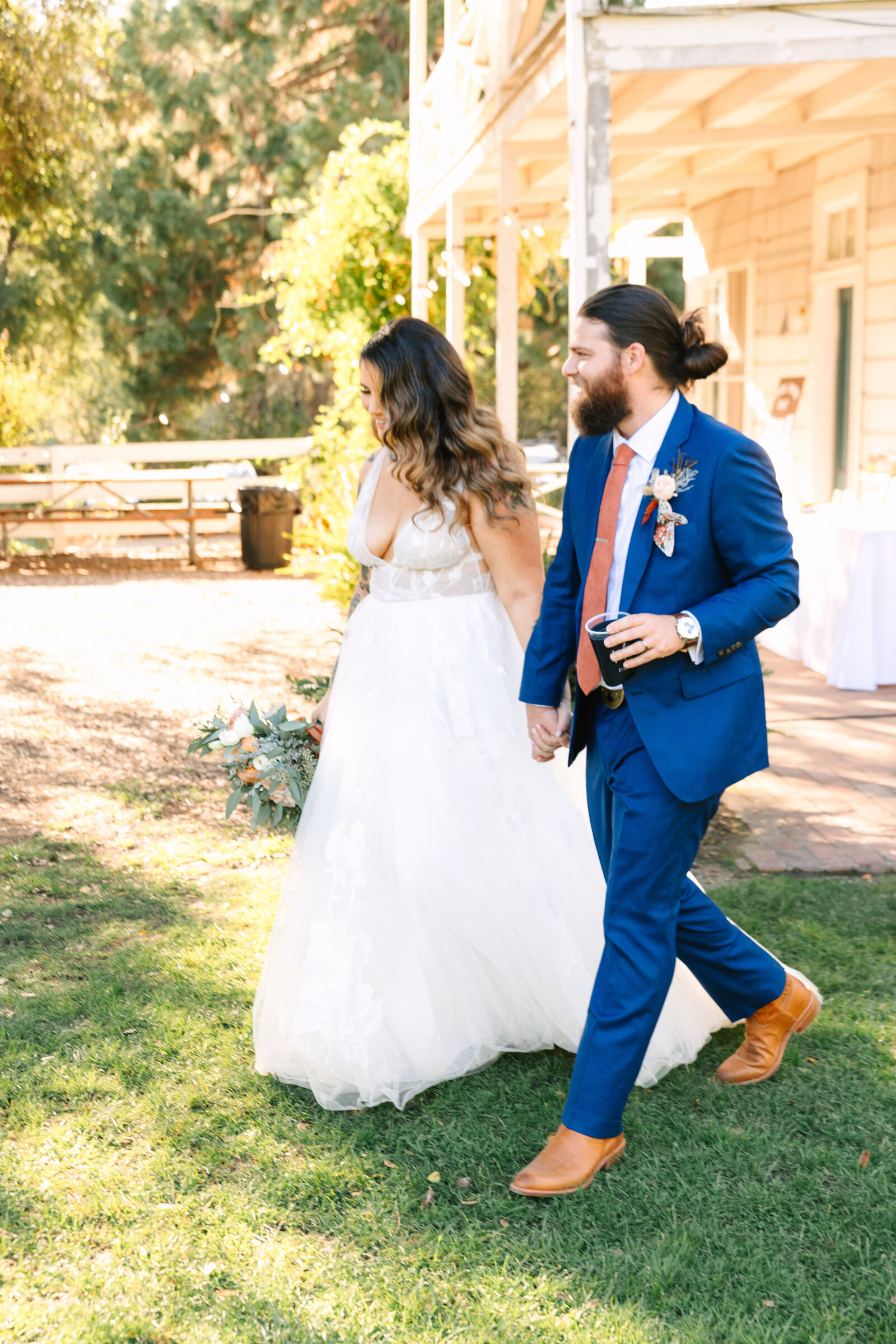 Tattoo bride and groom at their colorful wedding reception in Santa Cruz, California.