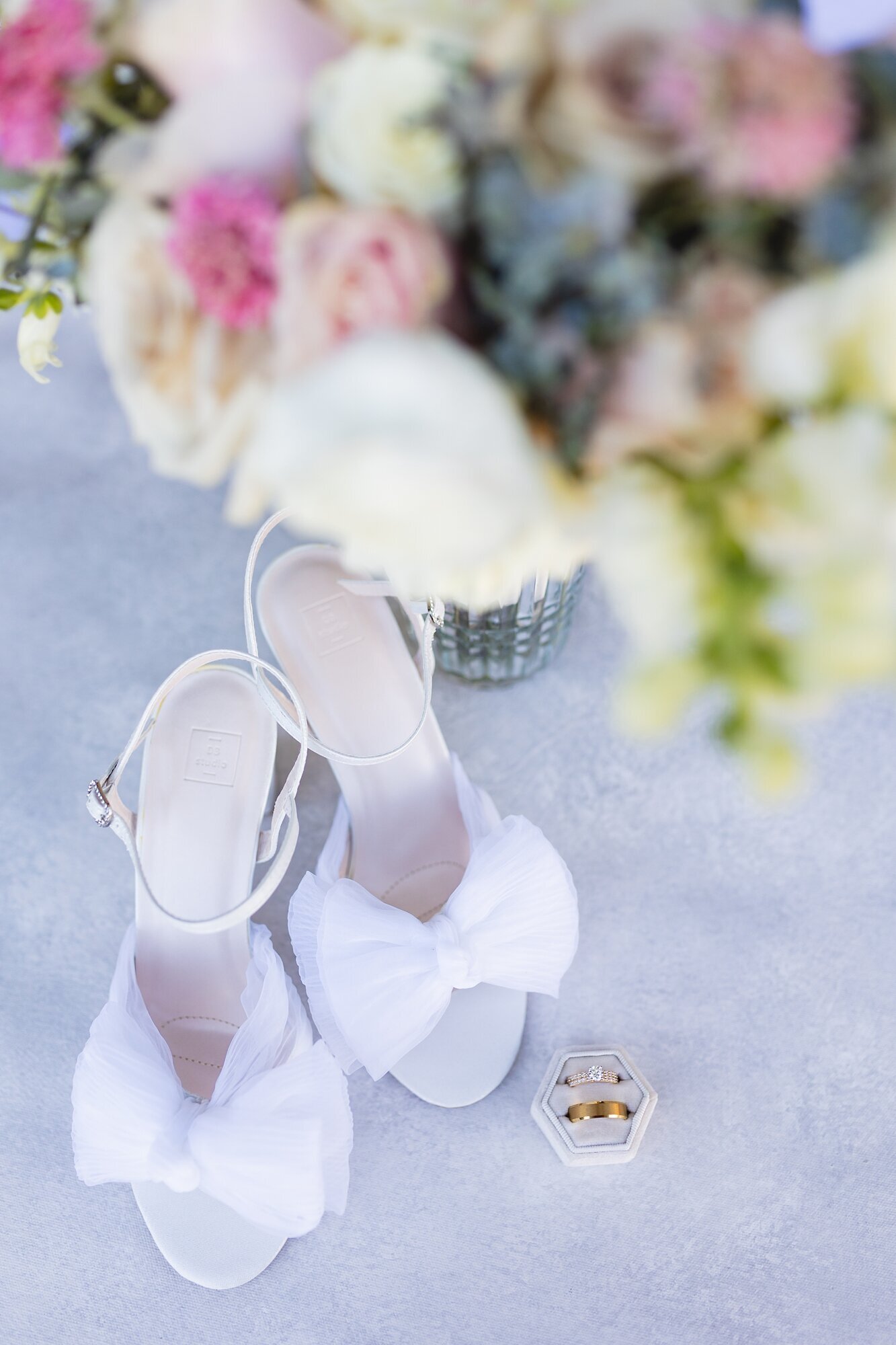 brides shoes, flowers, and rings