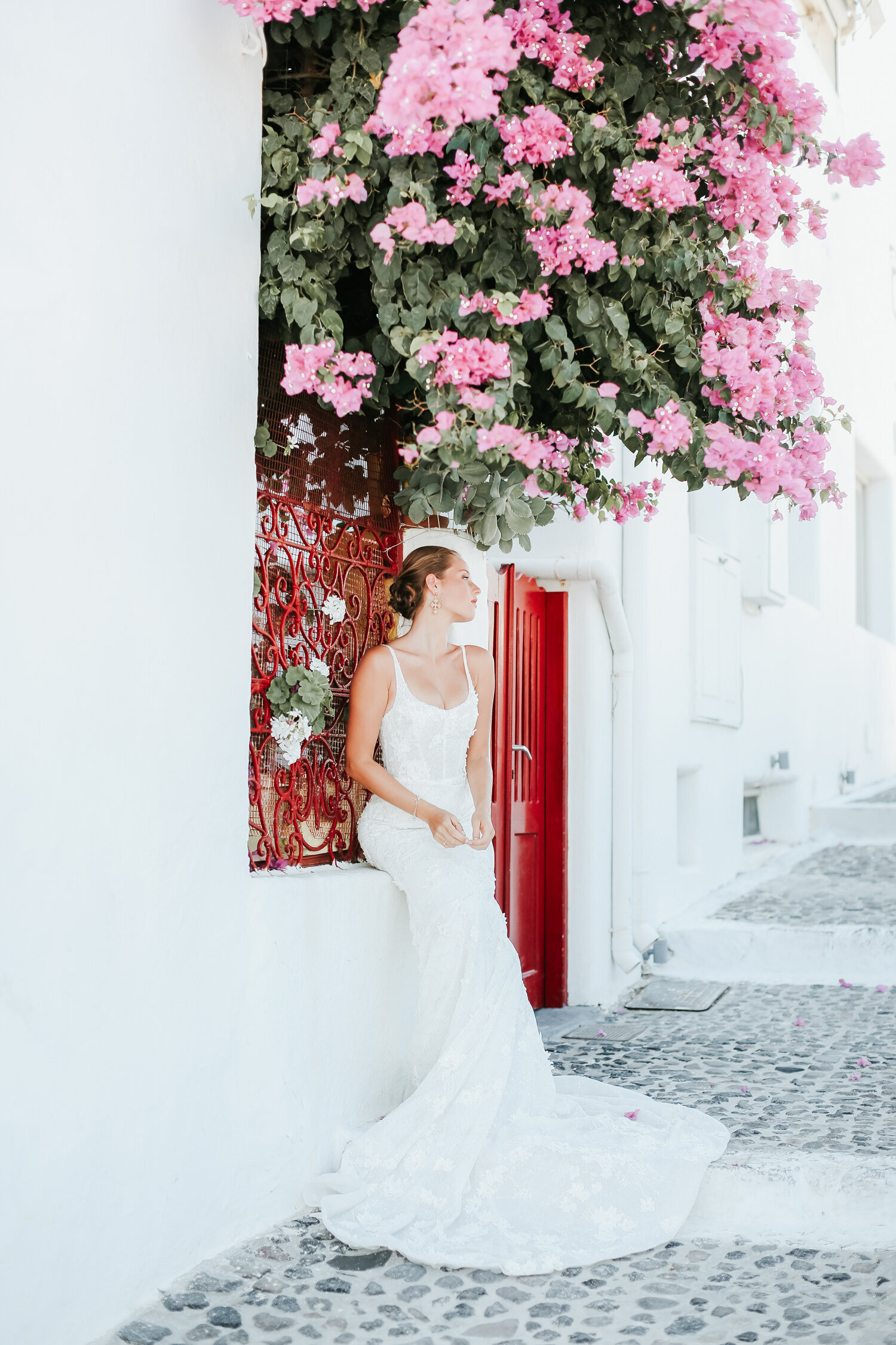 Santorini-bride-sitting-under-blossom-tree
