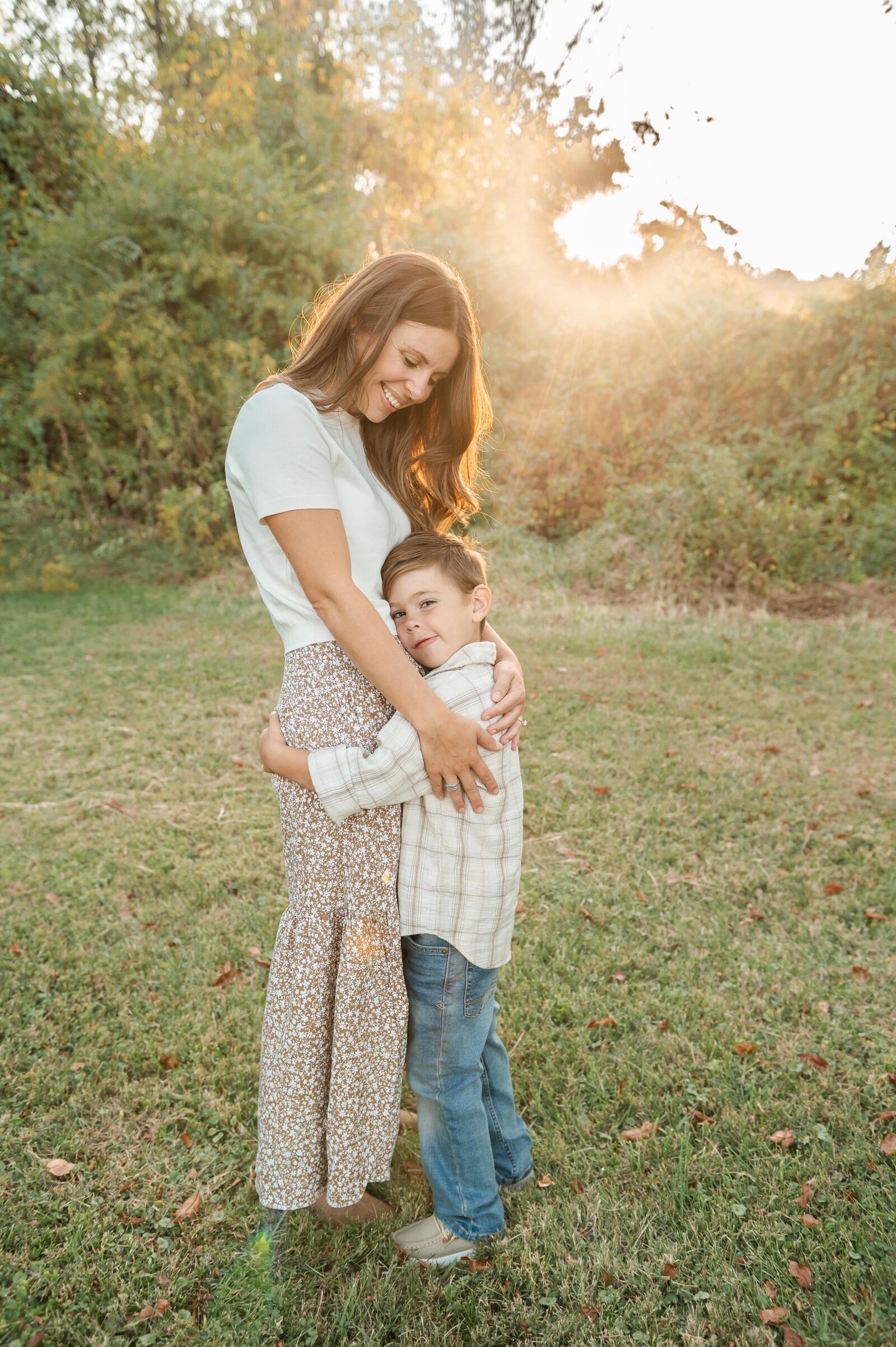 Parents cuddling their children during a relaxed lifestyle session with a Baltimore family photographer.