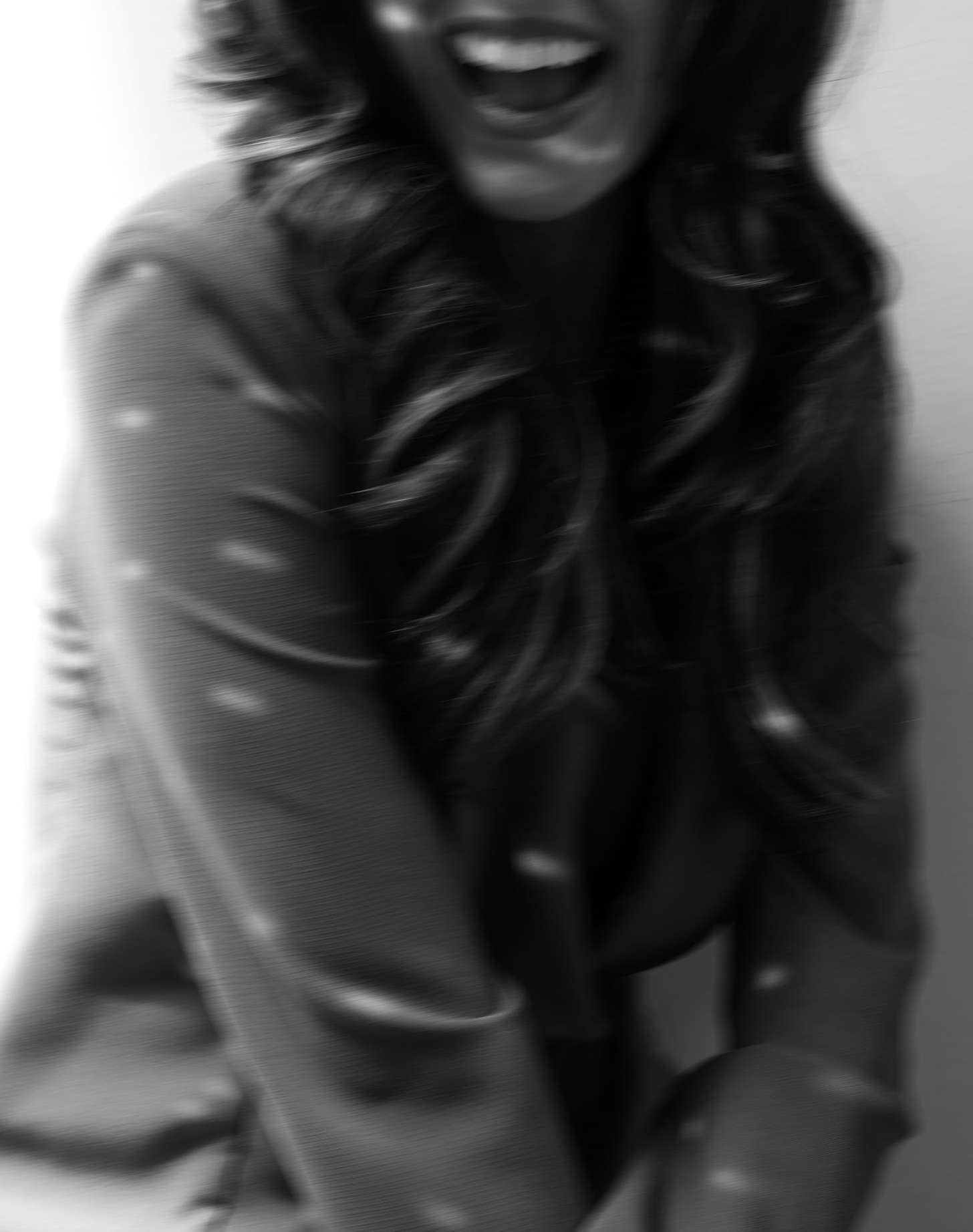 Kat Shubert from the Salesgirls smiling in a black and white photo