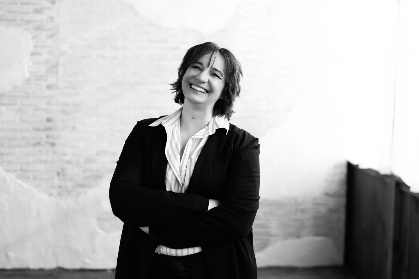 black and white photo of a woman standing
