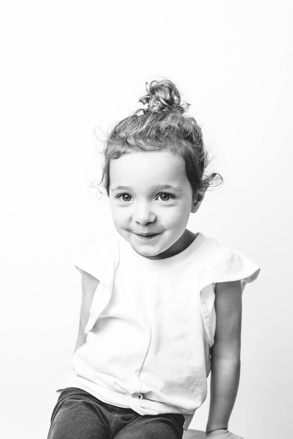 Sweet girl, looking shyly at her portrait Tampa photographer