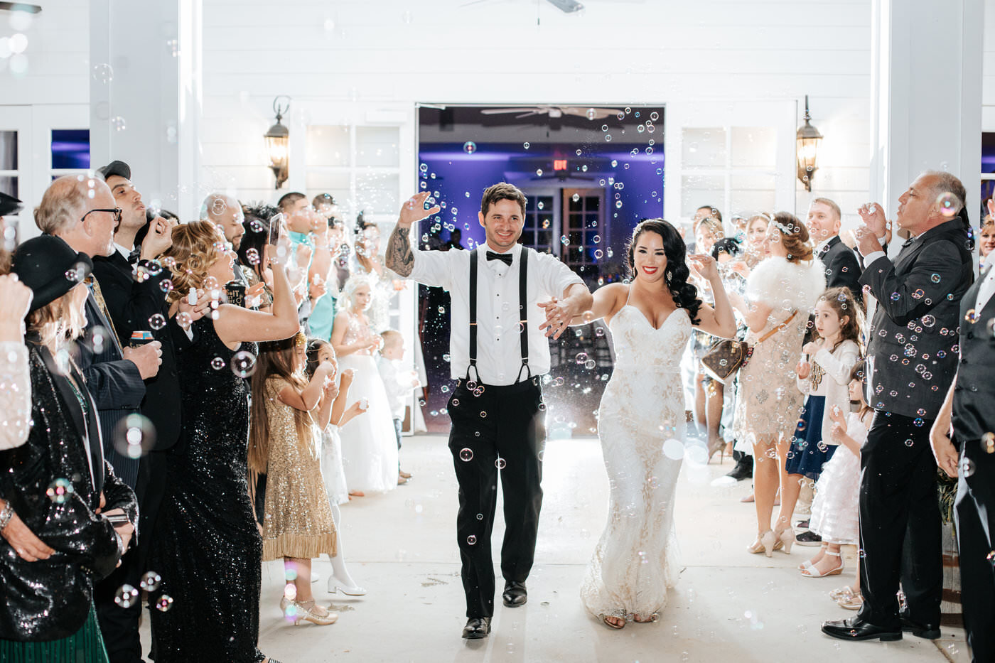 A bride and groom make their grand exit following their Kendall Point wedding.