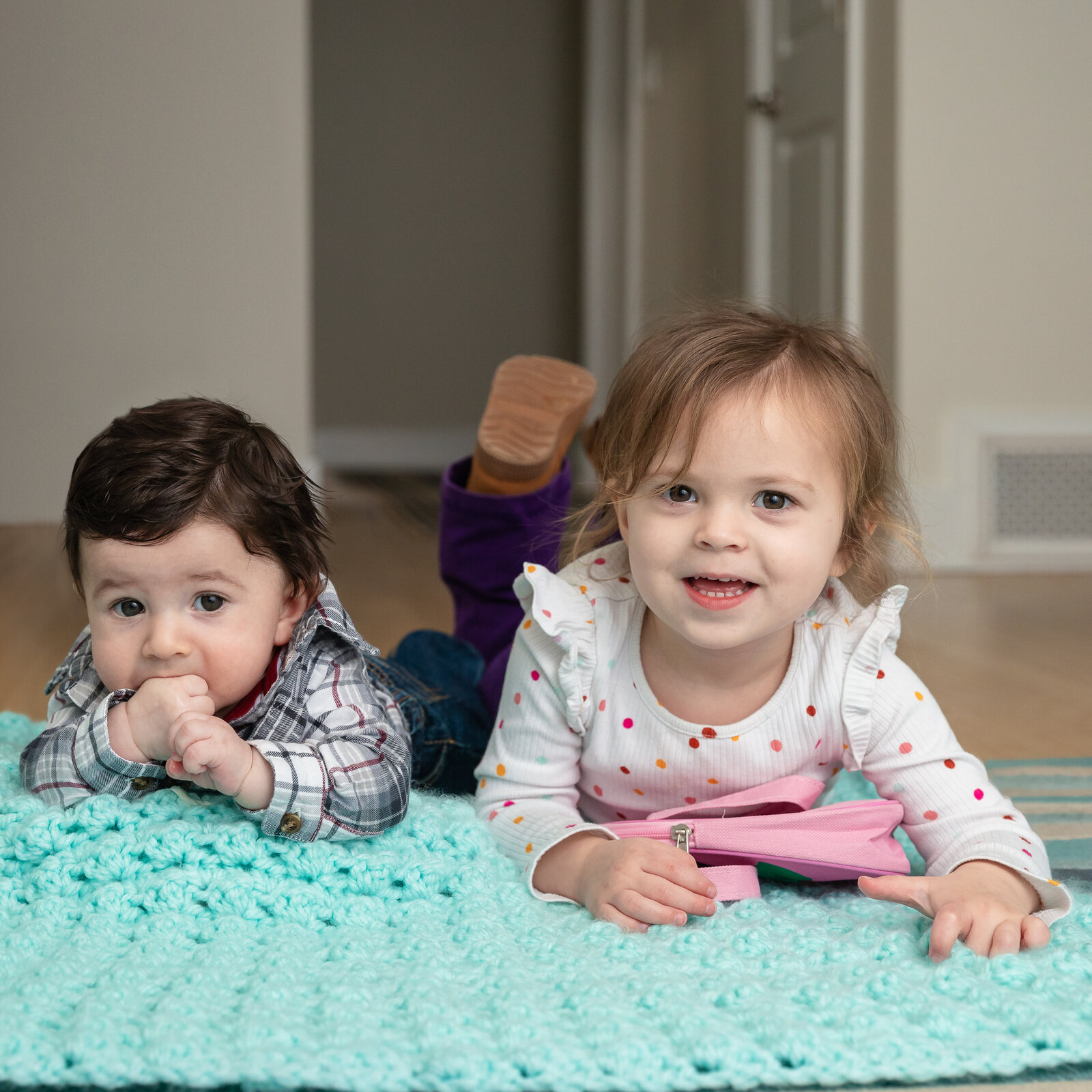 siblings-smiling-in-home-nj-family-photographer