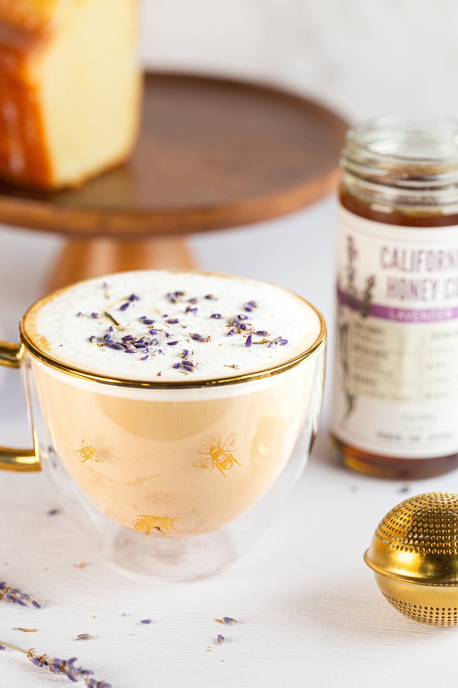 Styled product photography for local honey company featuring gold bee mug and lavender honey latte.