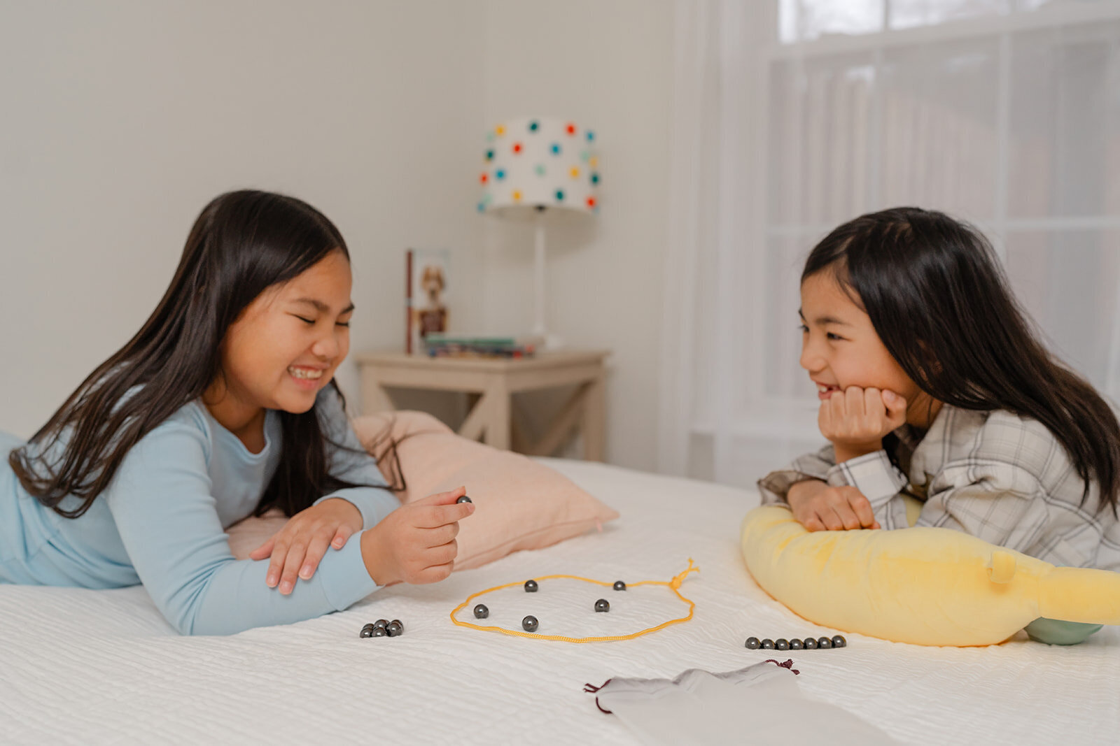 kids playing board game in their bedroom during lifestyle product photo in McLean,Virginia
