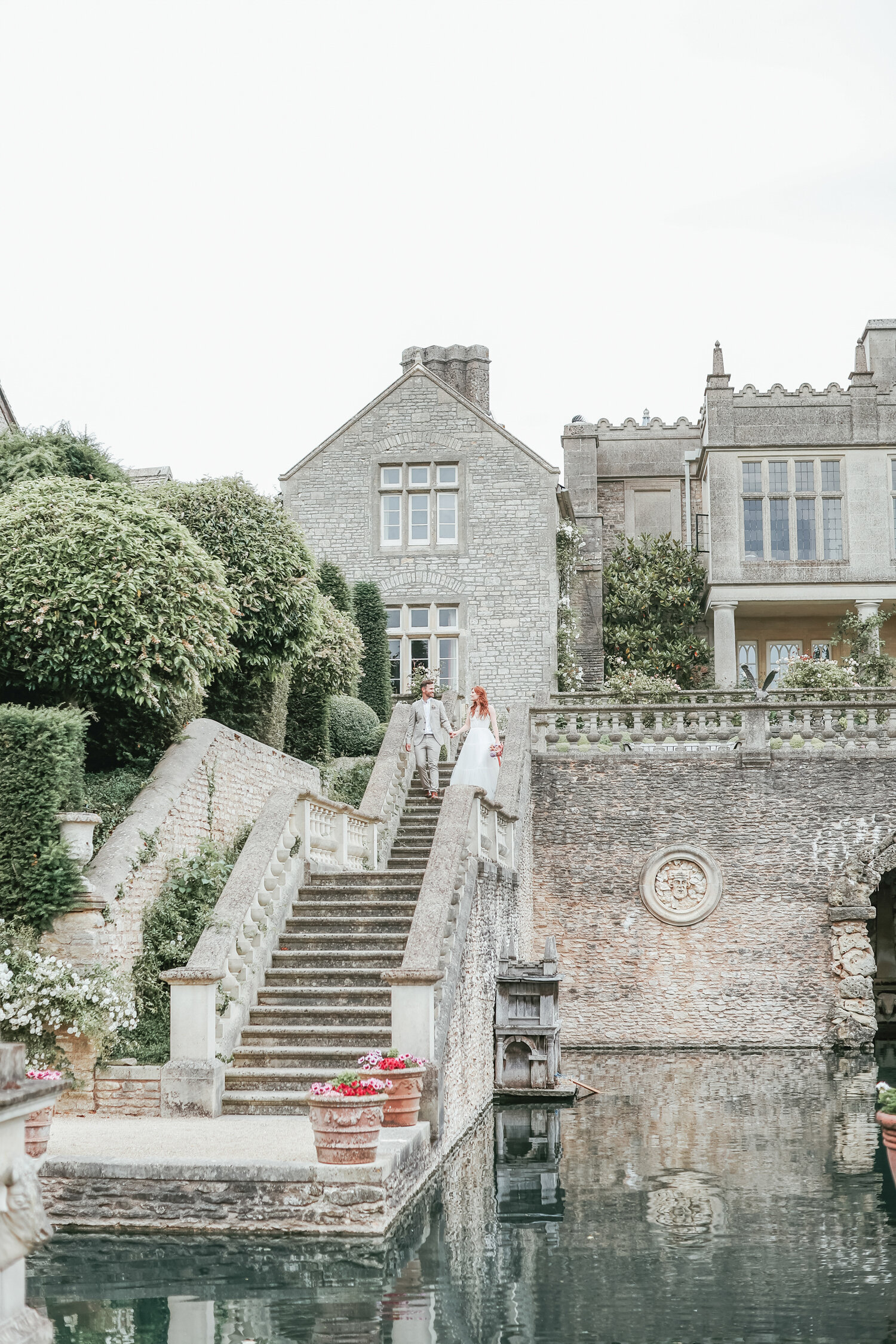 Euridge-Manor-wedding-couple-walking-towards-lake