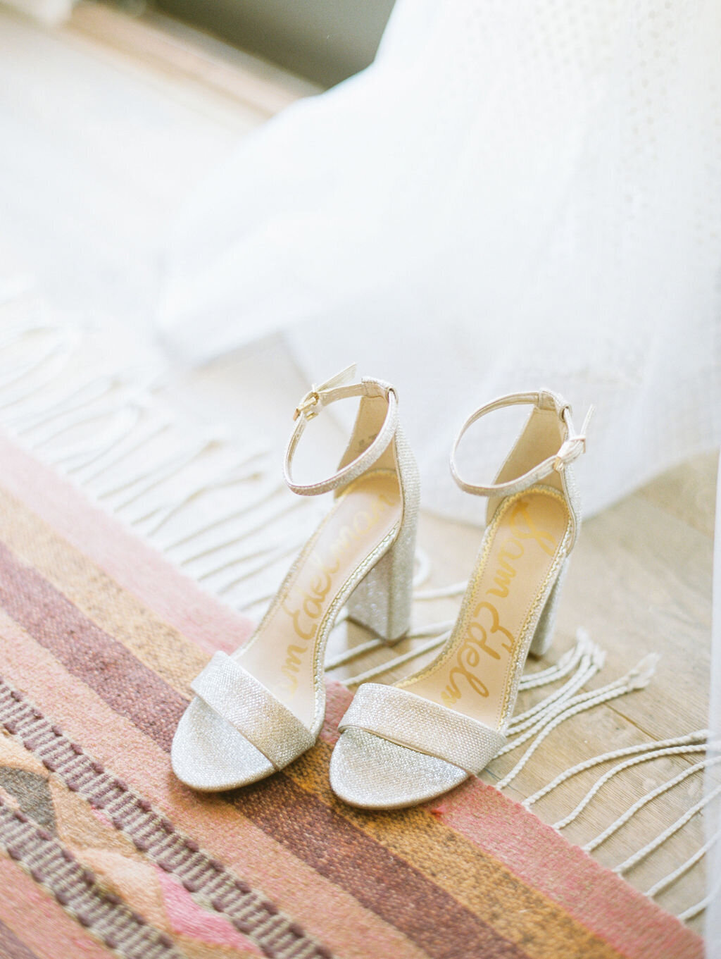White wedding shoes on rug at Rancho Santa Fe wedding