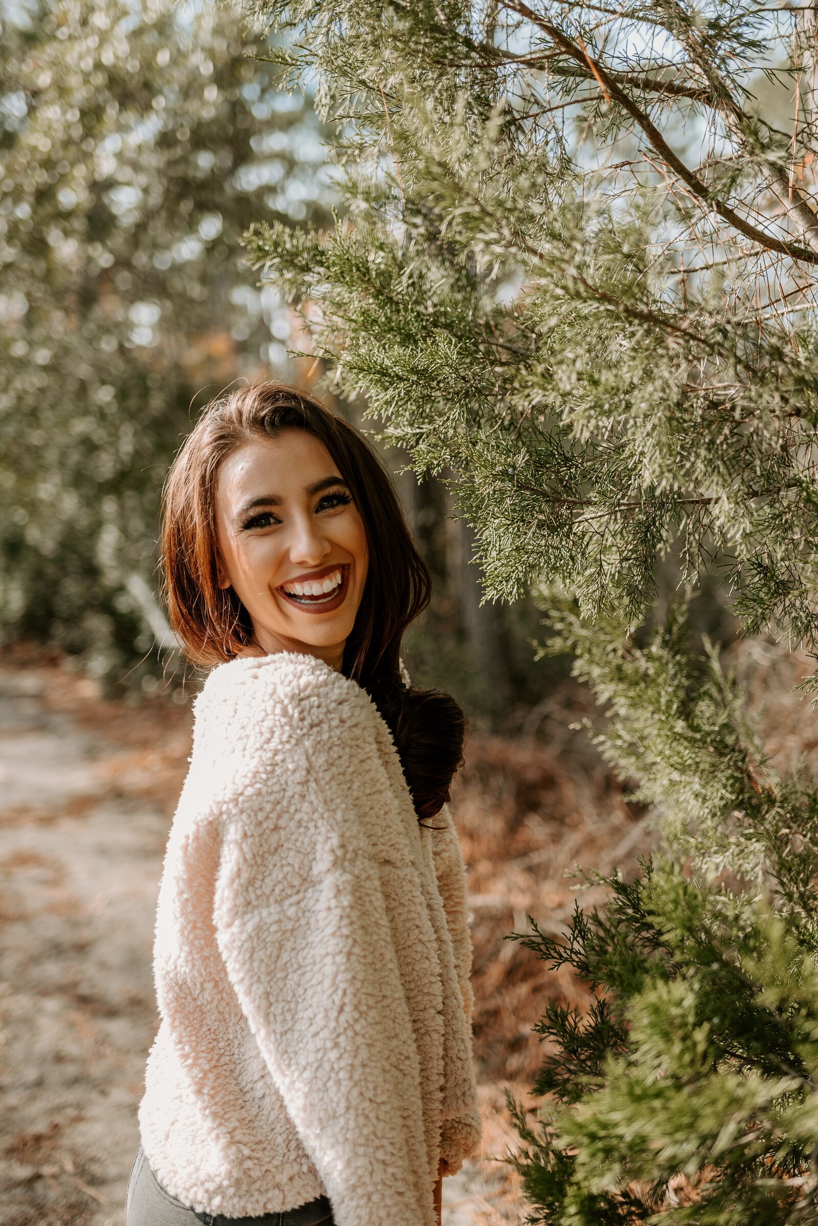 laughing next to plants