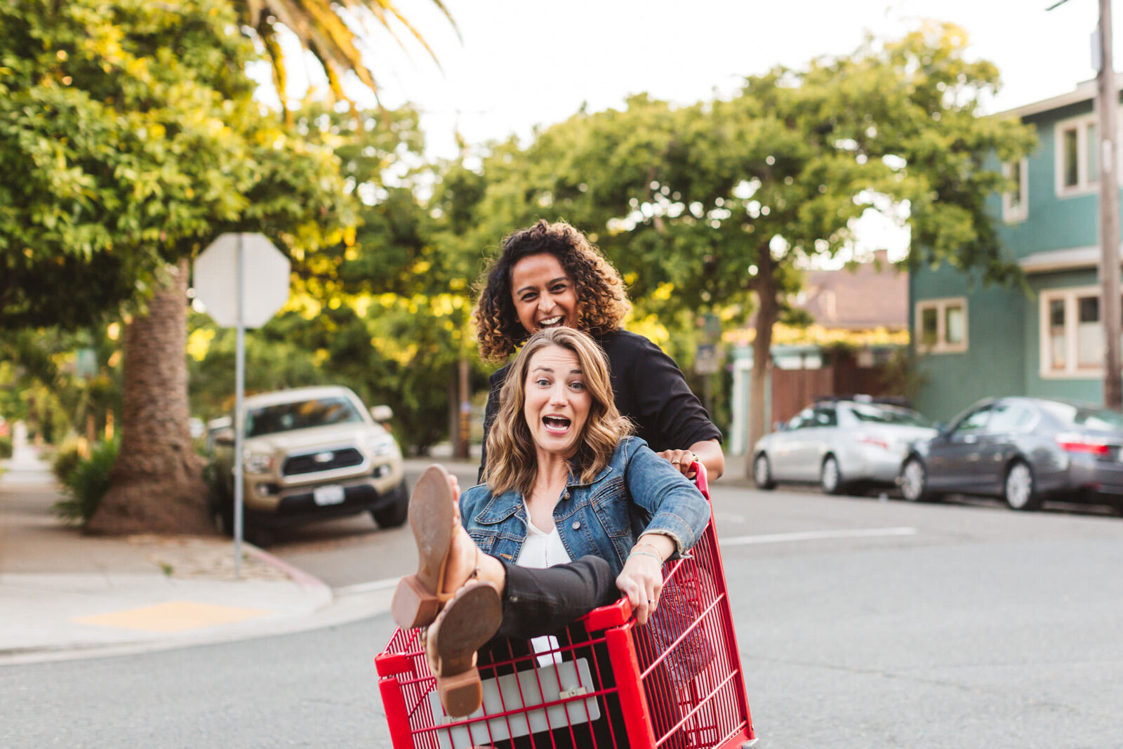 couple in shopping cart for engagement photos