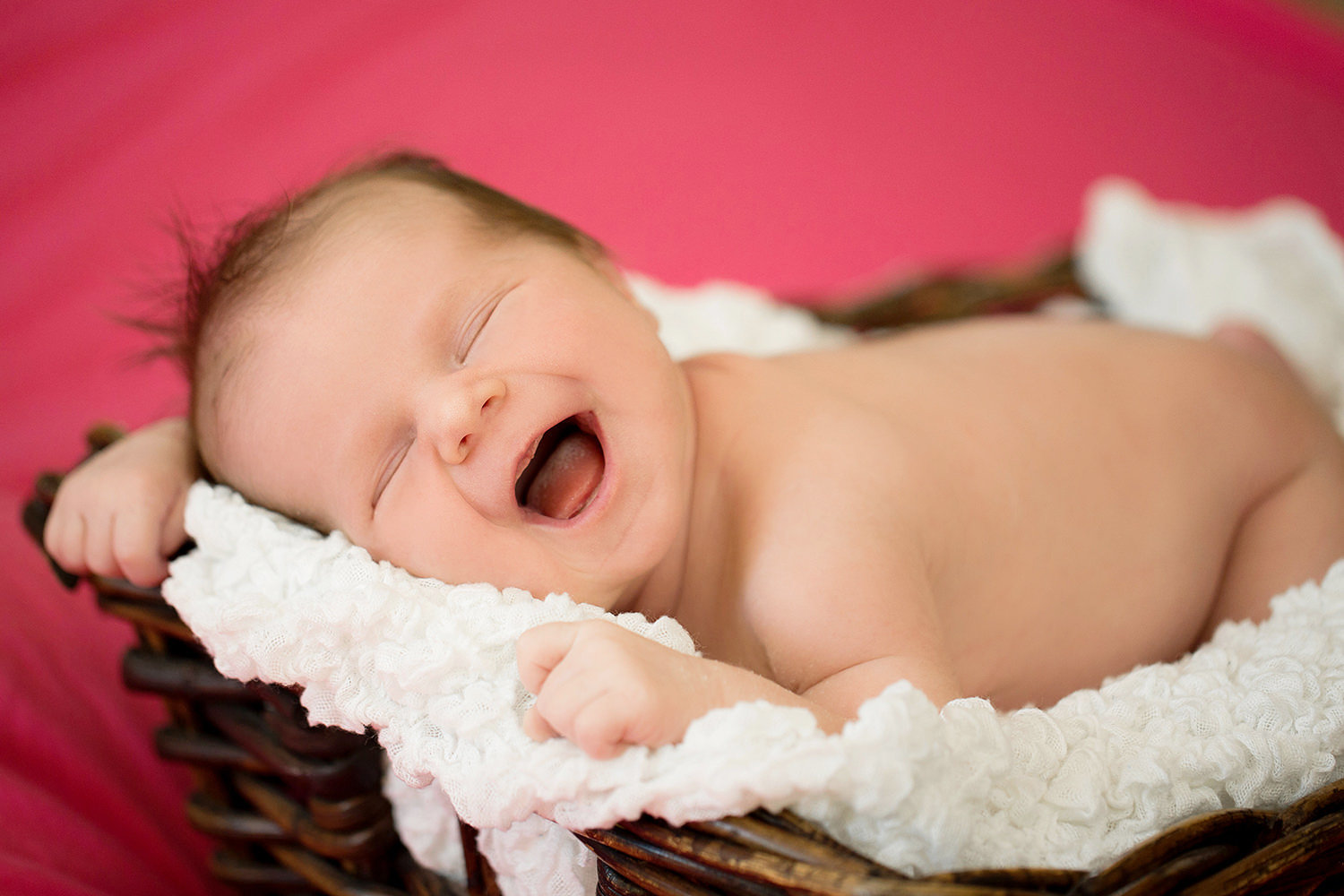 san diego newborn photography | newborn girl with colorful pink background in basket