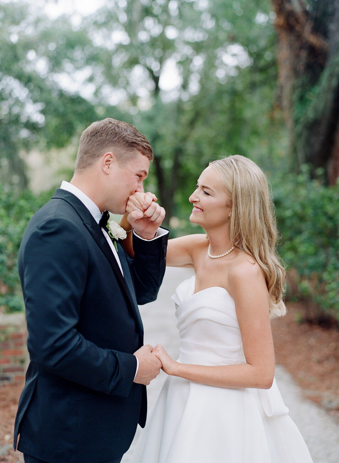 Groom Kissing Brides Hand