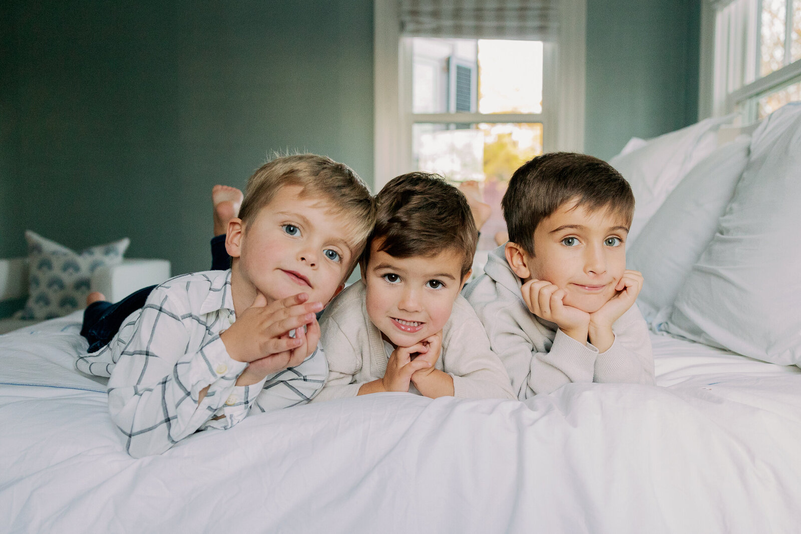 Three brothers on bed