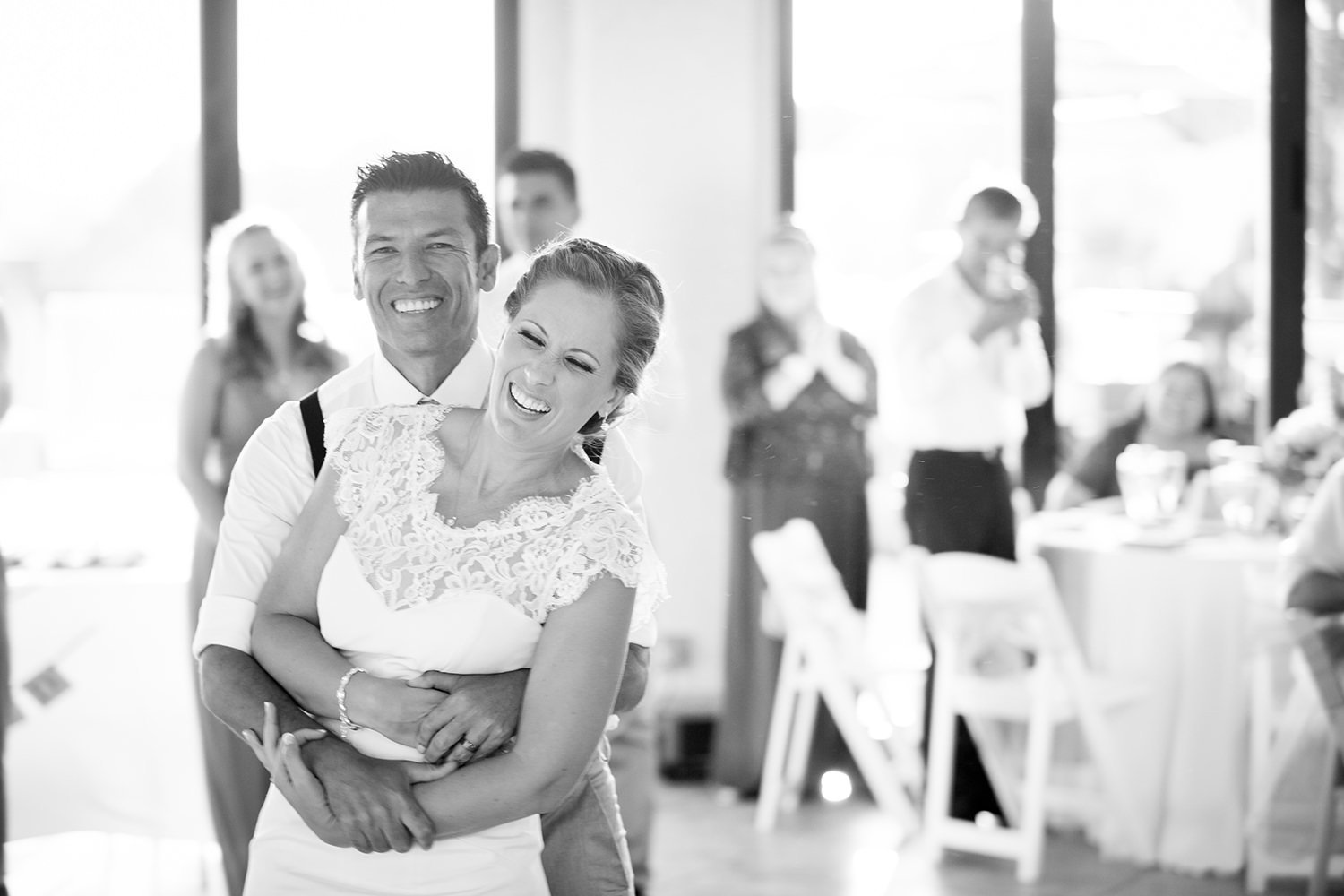 black and white dancing picture of bride and groom