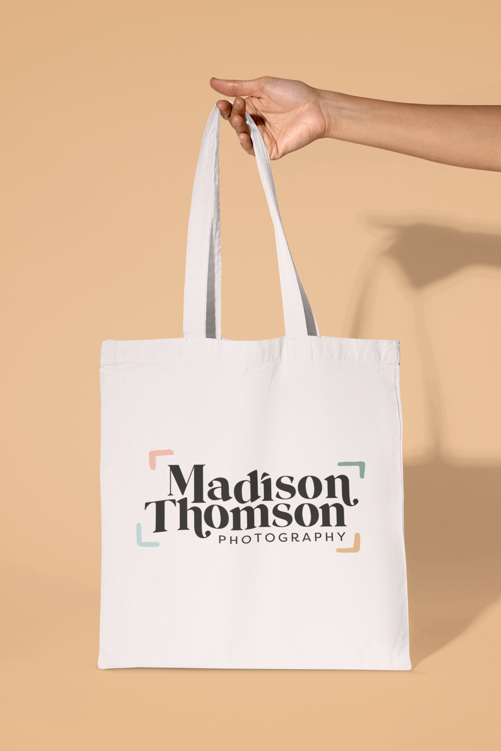 mockup-of-a-person-holding-a-sublimated-tote-bag-against-a-colorful-background-m32232 (1)