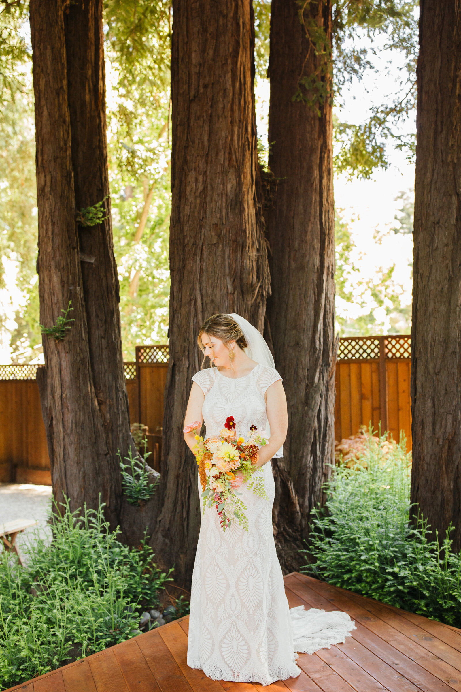 Bride on her colorful wedding day in Santa Cruz, California in the redwood trees.
