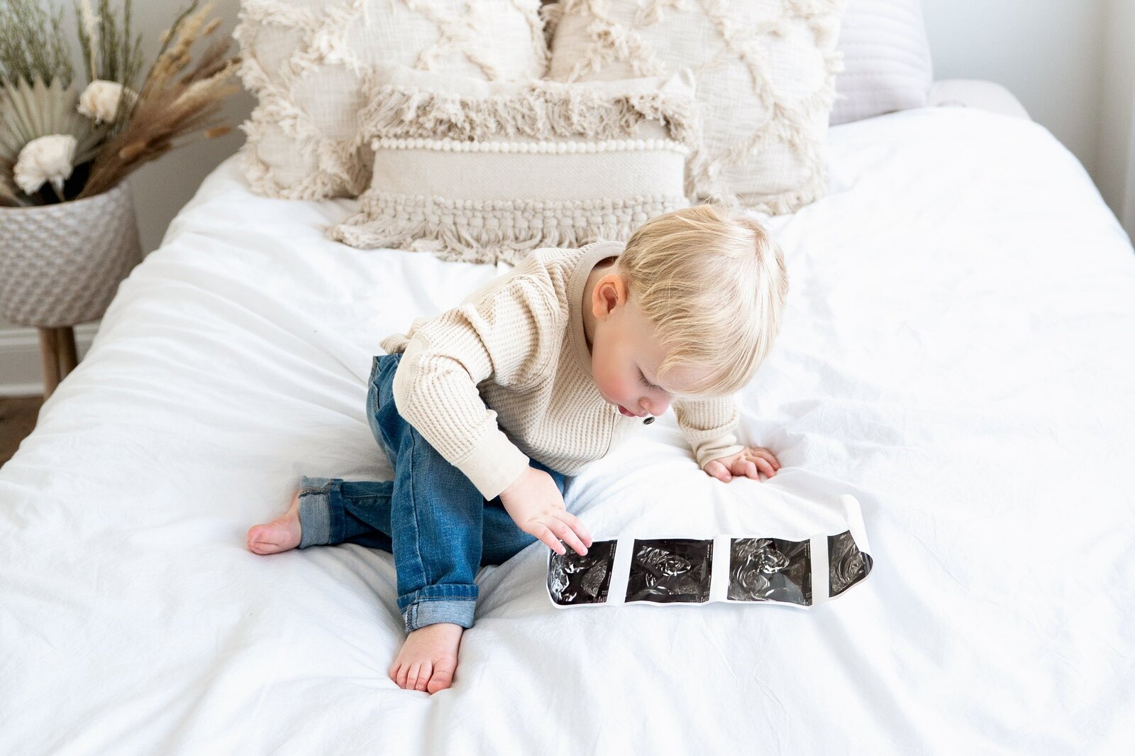 little boy looking at ultrasound pictures