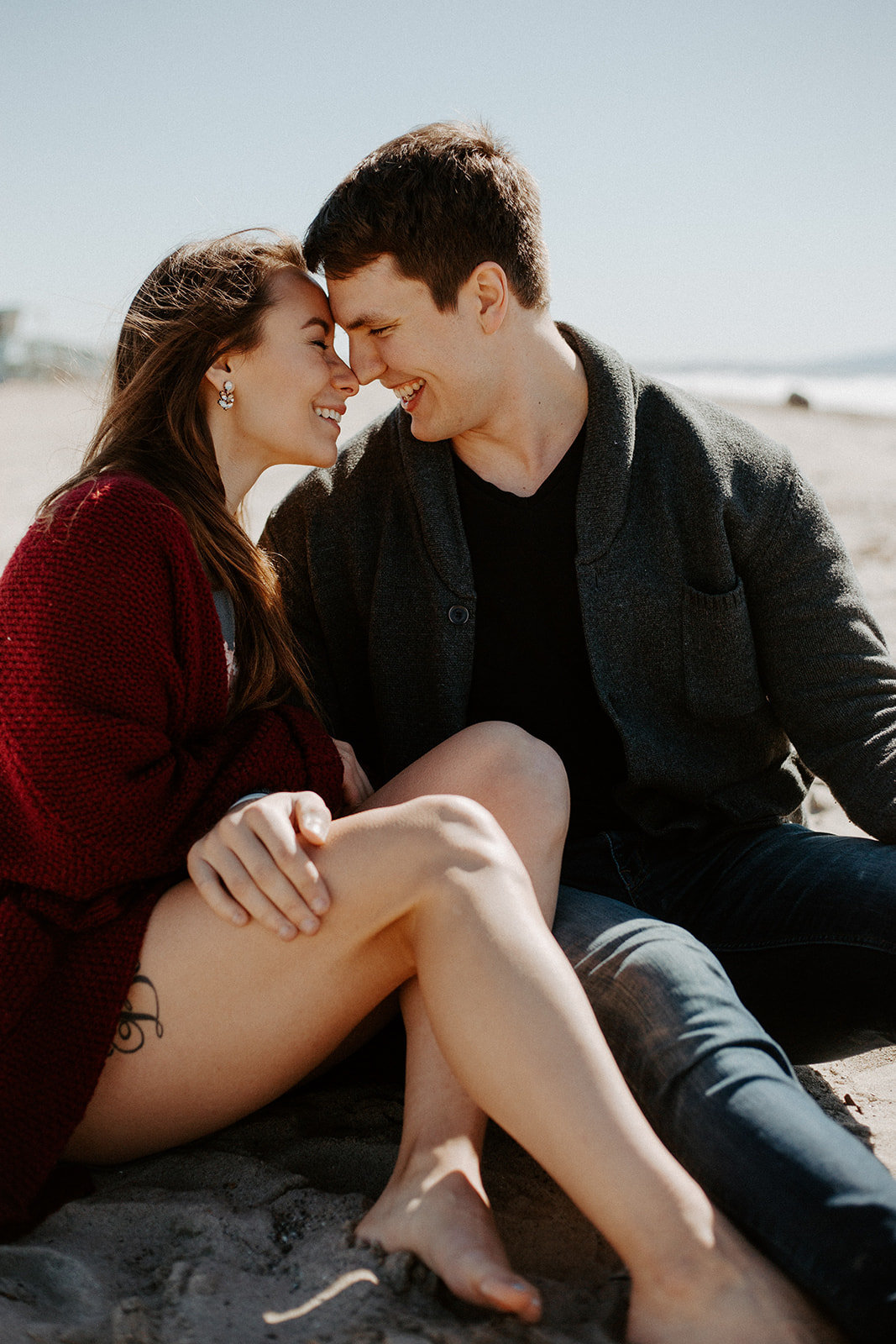 Couple together on the beach during their engagement session