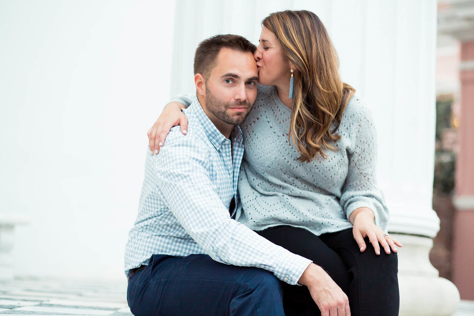 Couple sits on steps of Hibernian Hall for Engagement