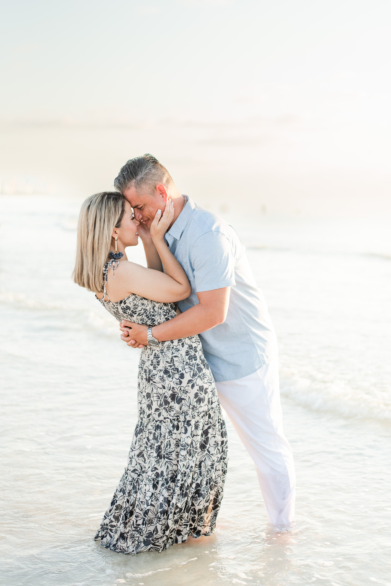 couple hugging and walking on the beach family session by Miami lifestyle  photographers David and Meivys MSP Photography
