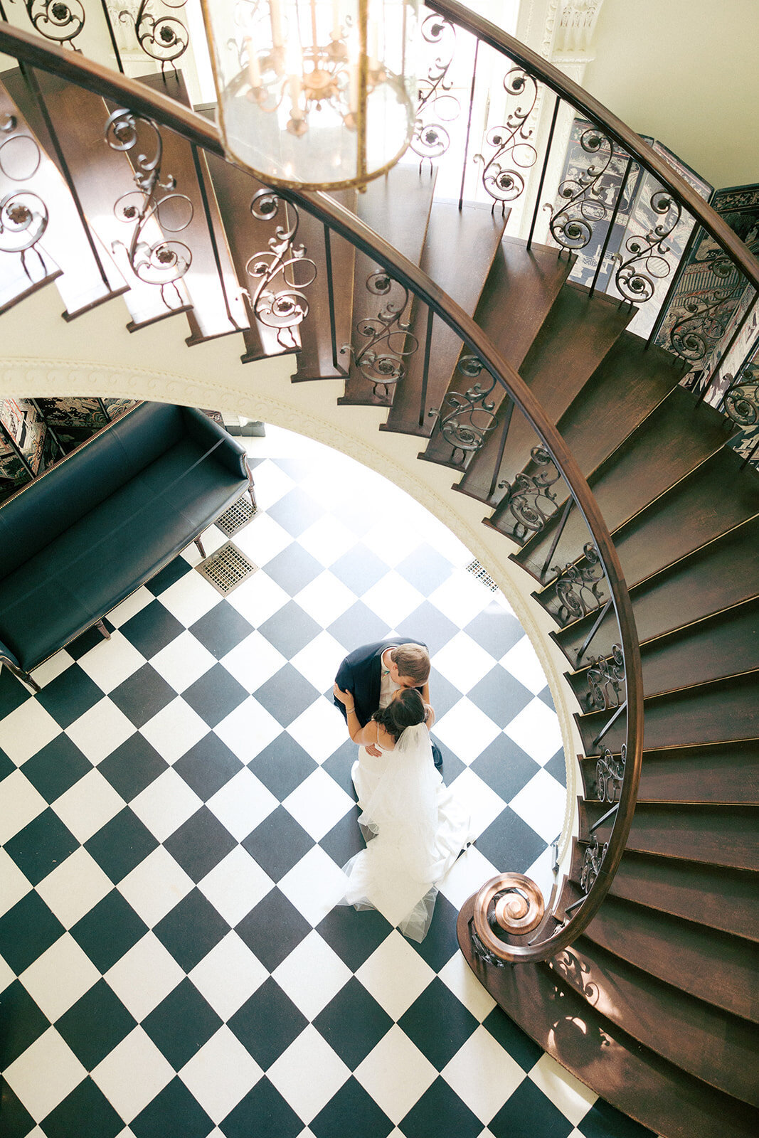 Bride and groom dance beneath stairs of Atlanta History Center
