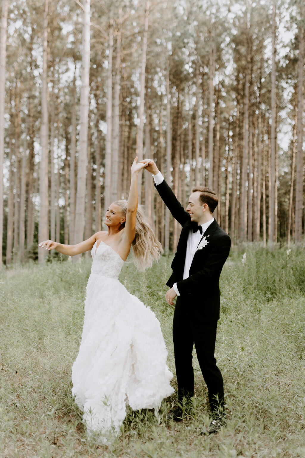 woodland-wedding-groom-twirling-bride