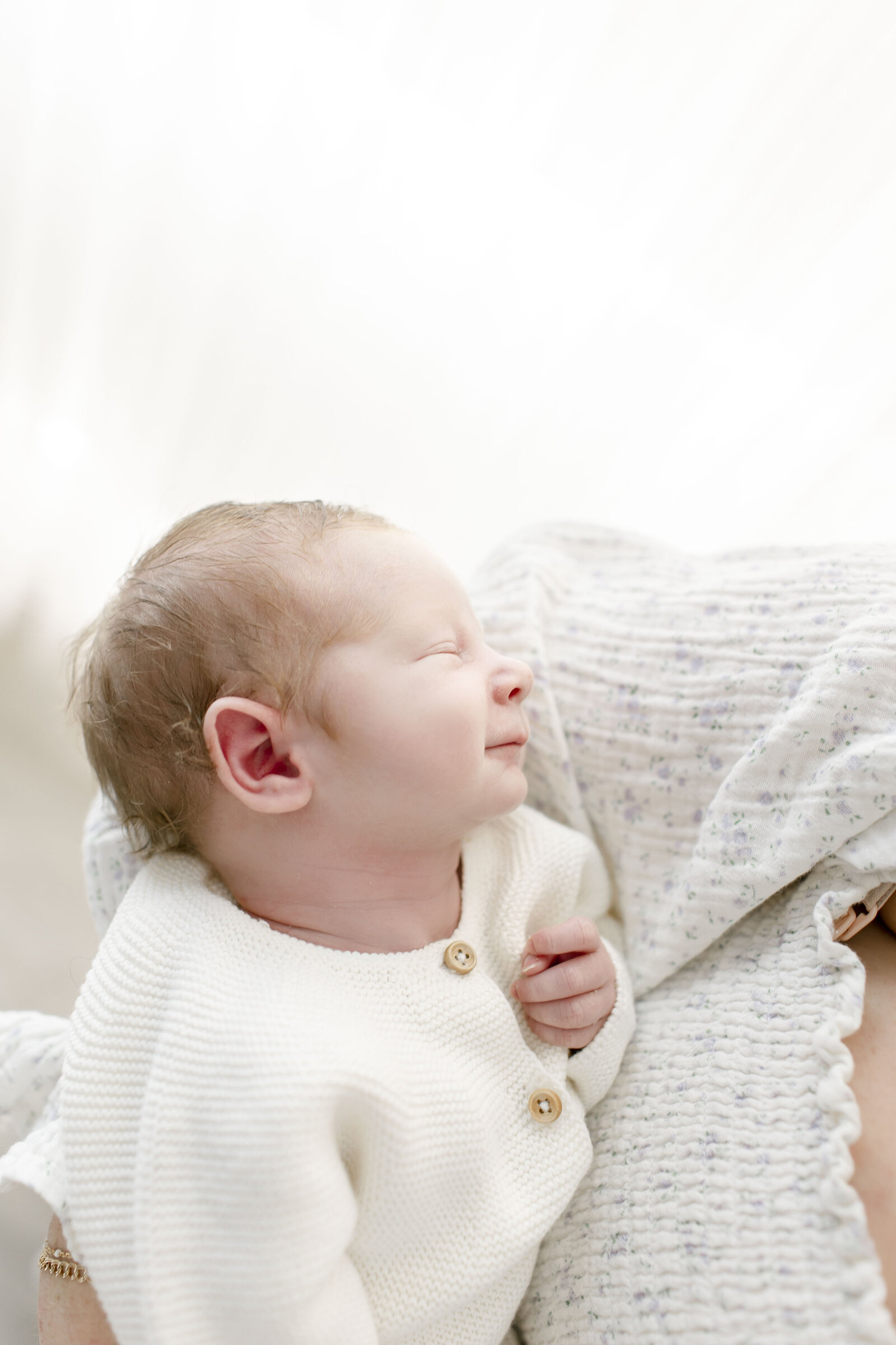 baby smiling at mom newborn photography by ally kimpton
