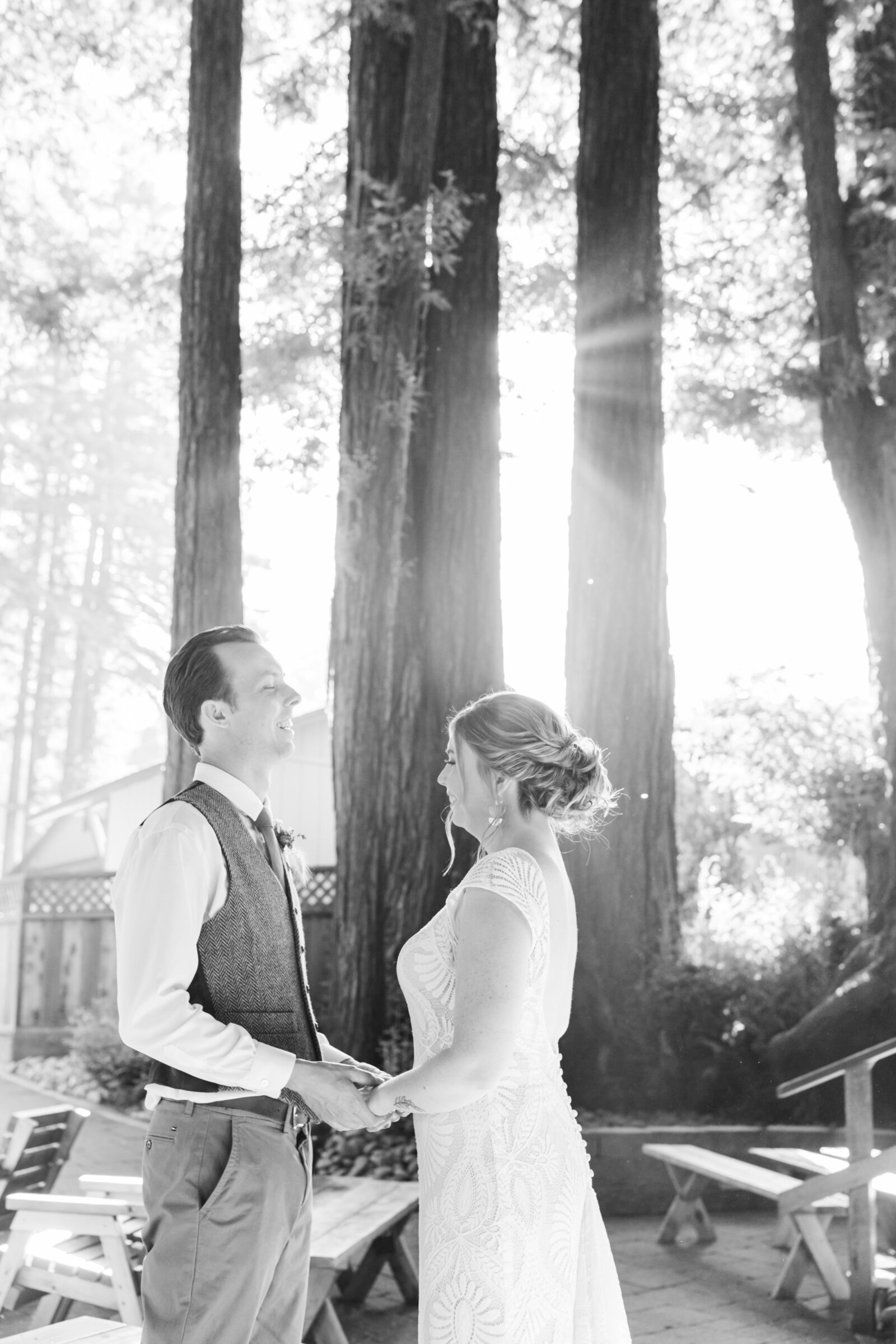 Bride and groom on their colorful wedding day in Santa Cruz, California in the redwood trees.
