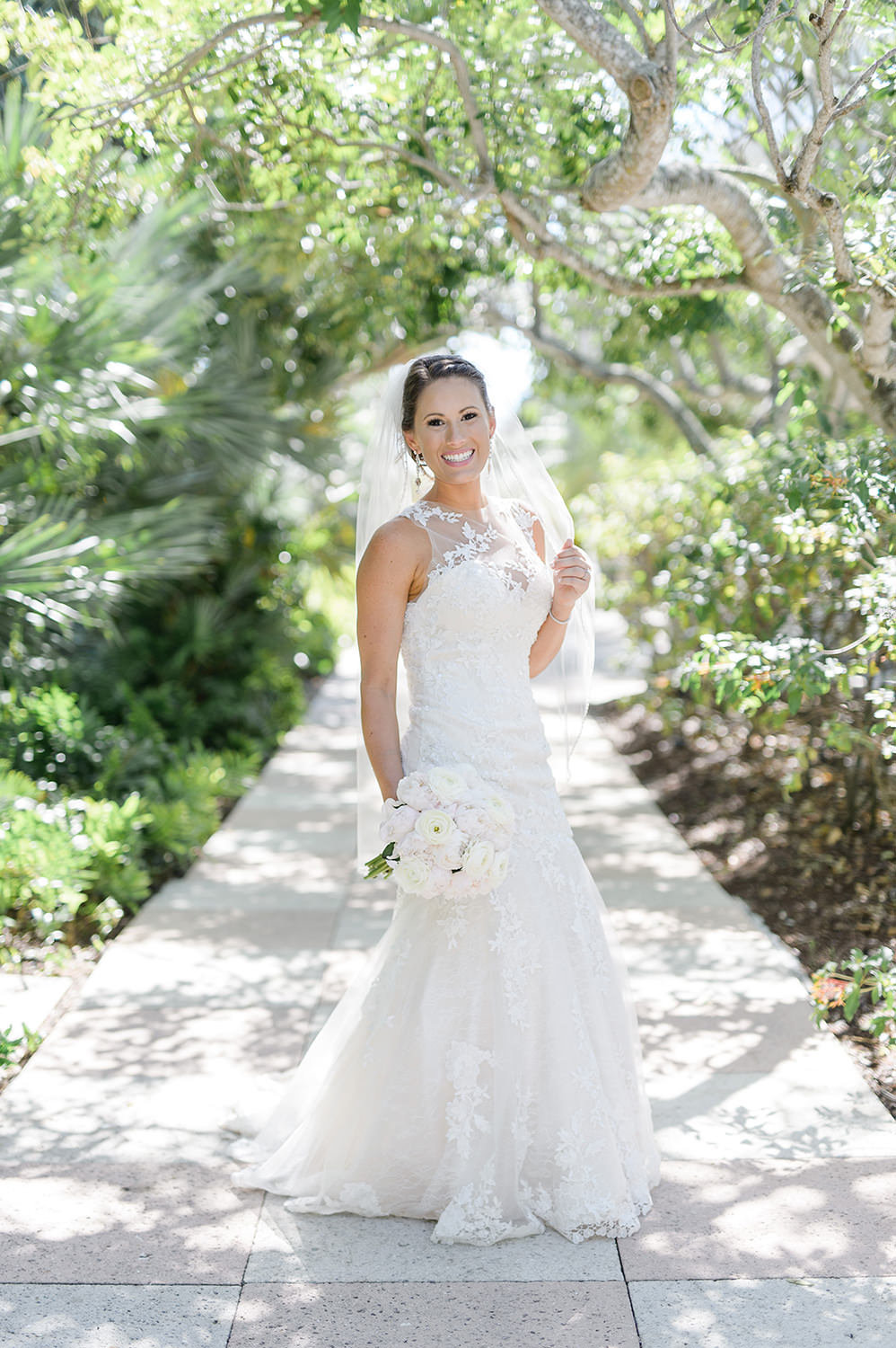 Bride posing outdoors before her wedding