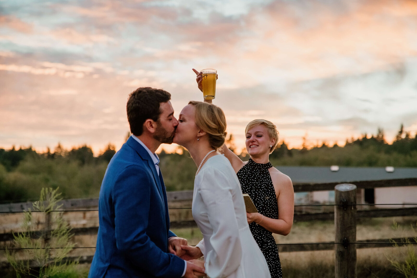 Bride and Groom kiss during wedding ceremony.