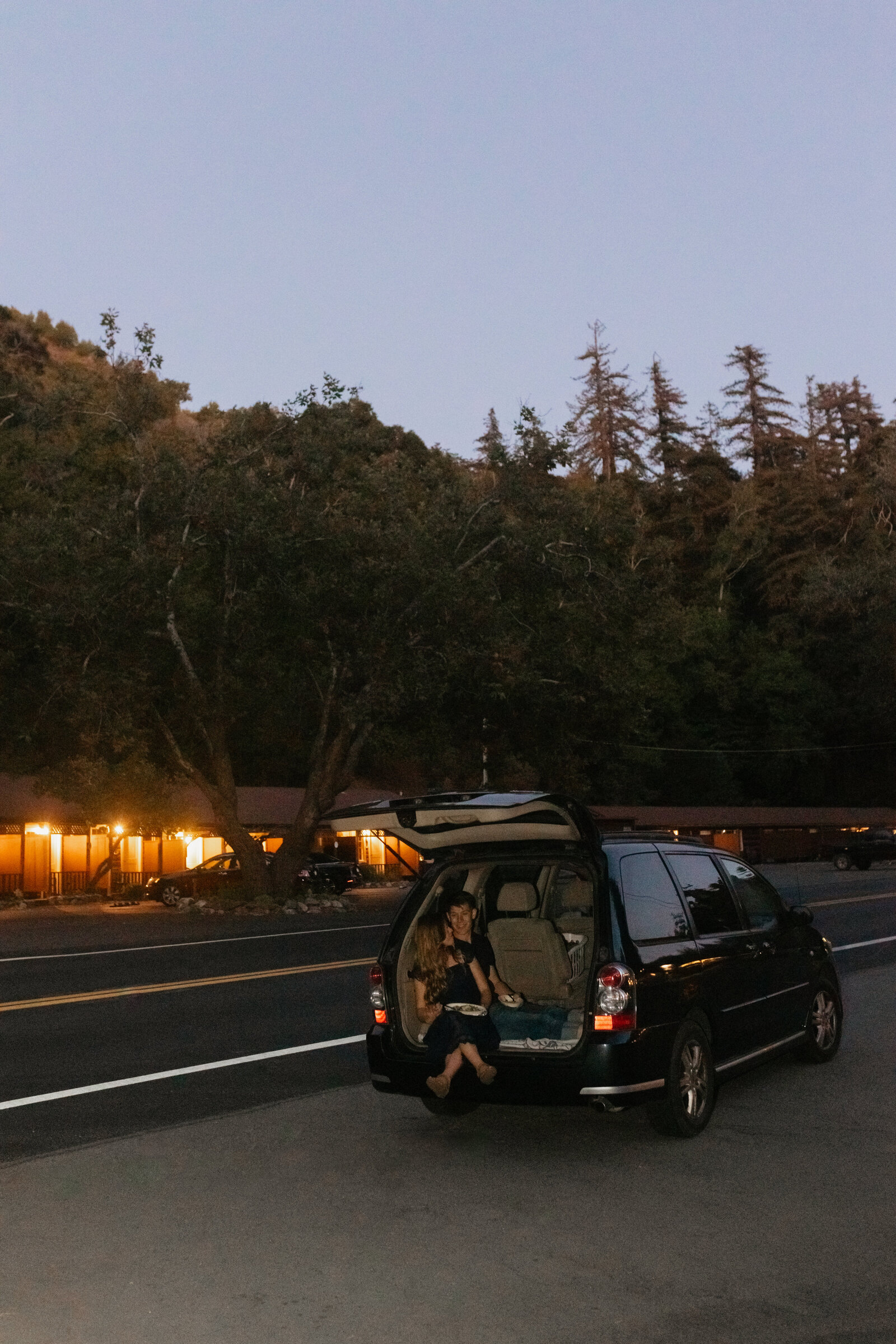 A couple poses for their engagement photos in Big Sur, California.