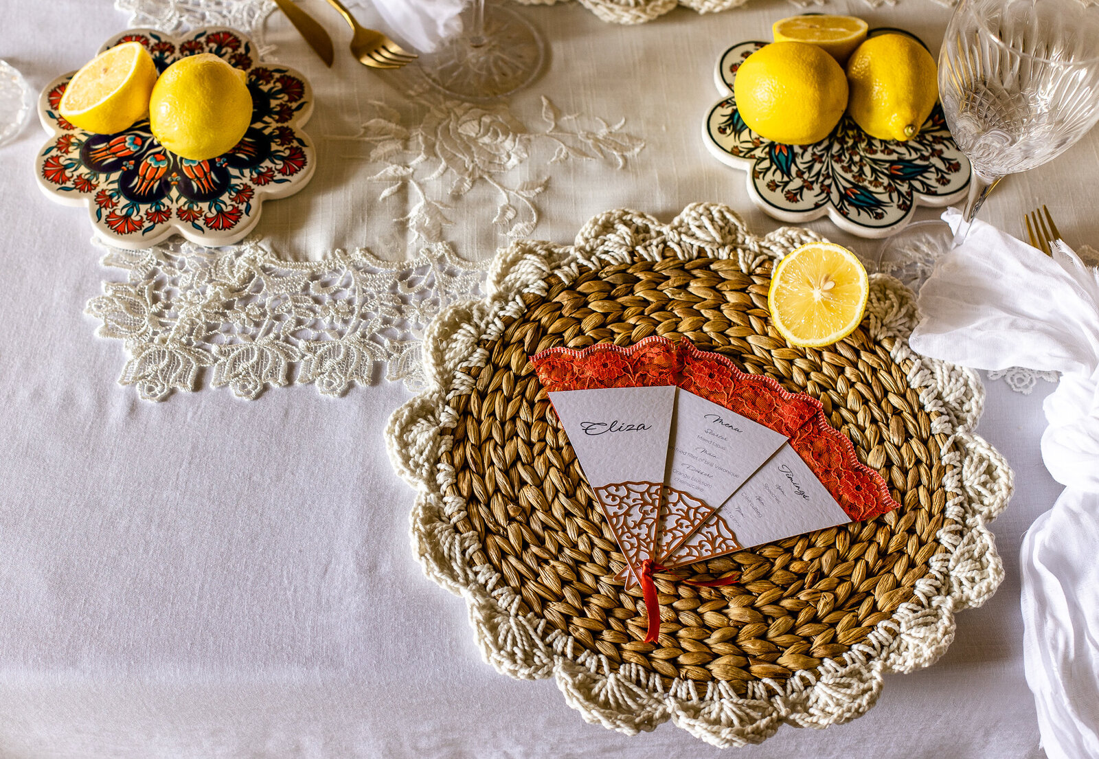 Wedding place card in the style of a Spanish fan opening to reveal menu