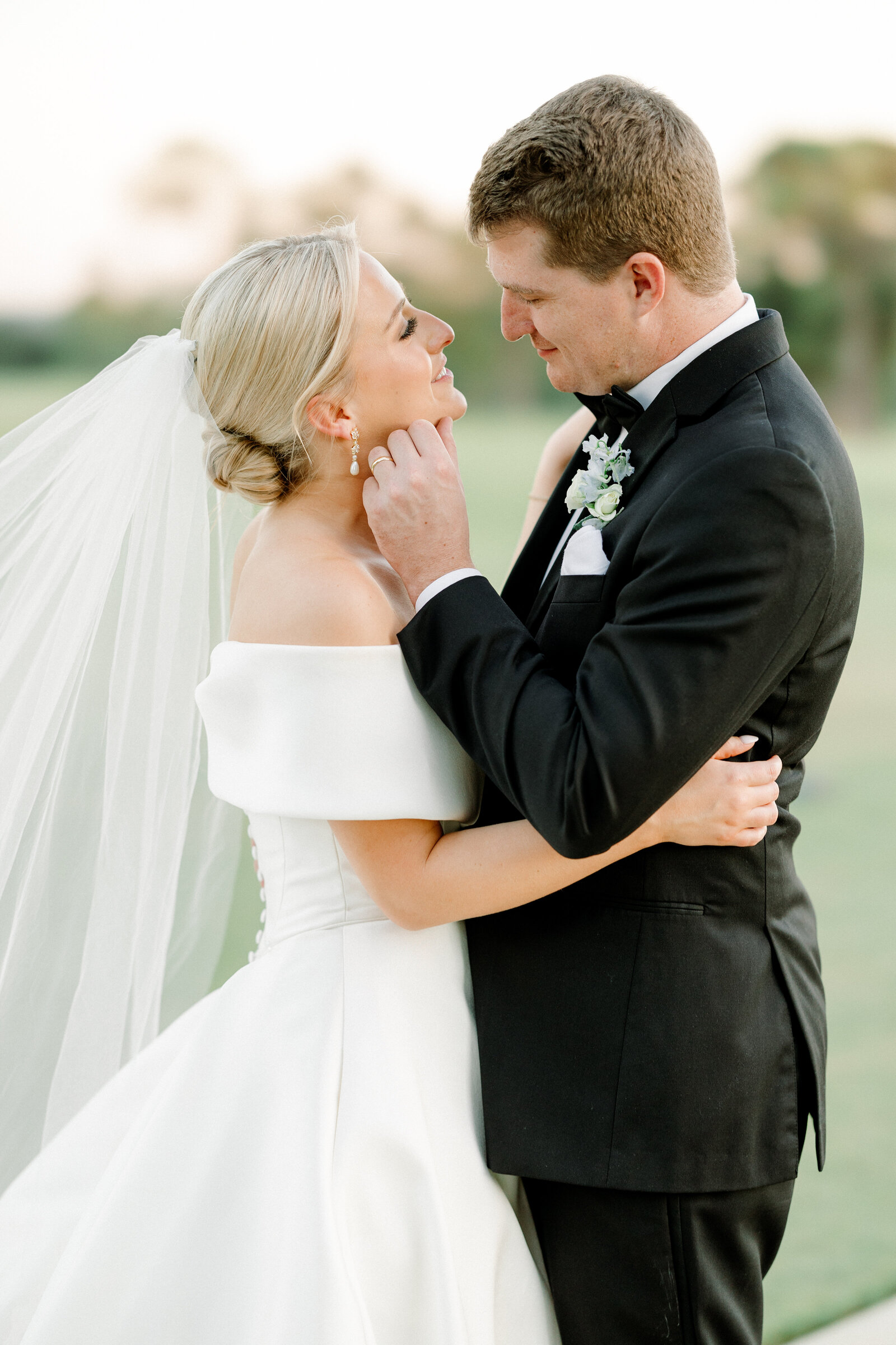 Mallory and Jack sharing a private moment, beautifully captured by an Alabama couples photographer with expertise in fine art wedding photography.