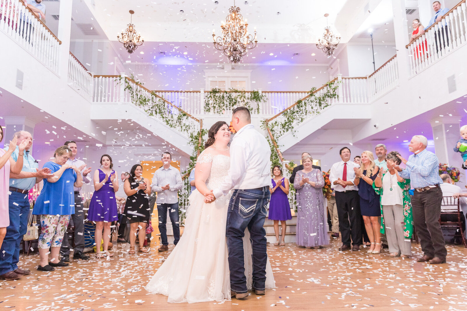 A bride and groom dance in the Kendall Point ballroom.