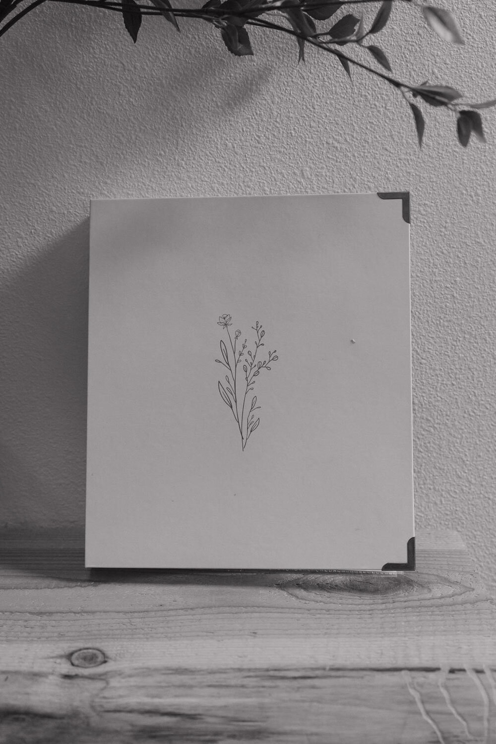 Black and white photo of wedding invitation