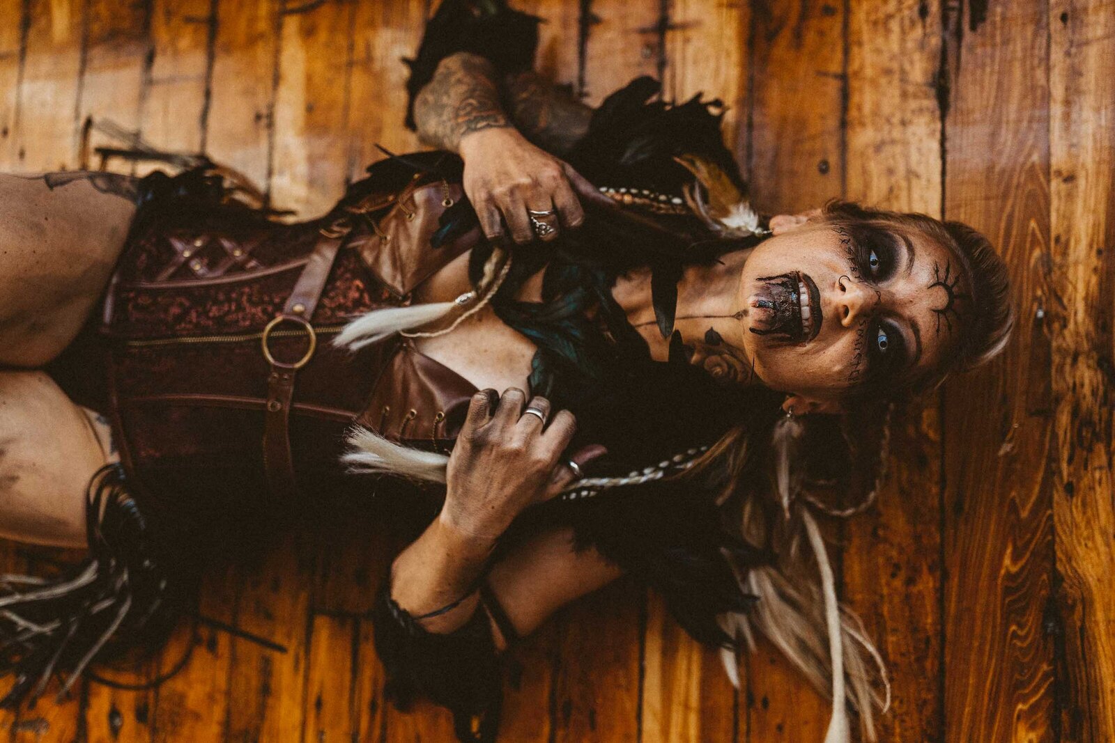 spooky looking woman laying on the floor