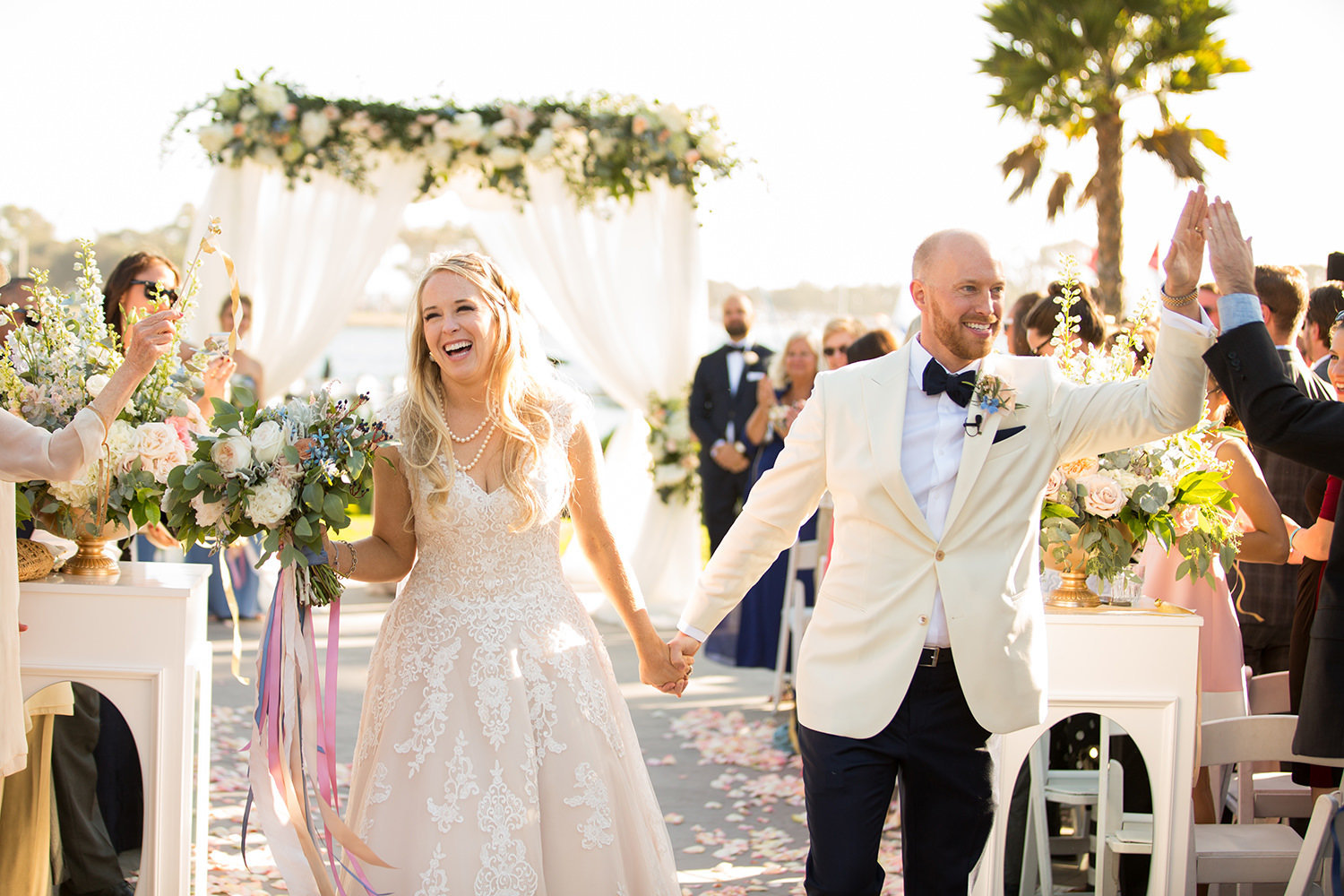 The celebration begins after the wedding ceremony as the bride and groom exit