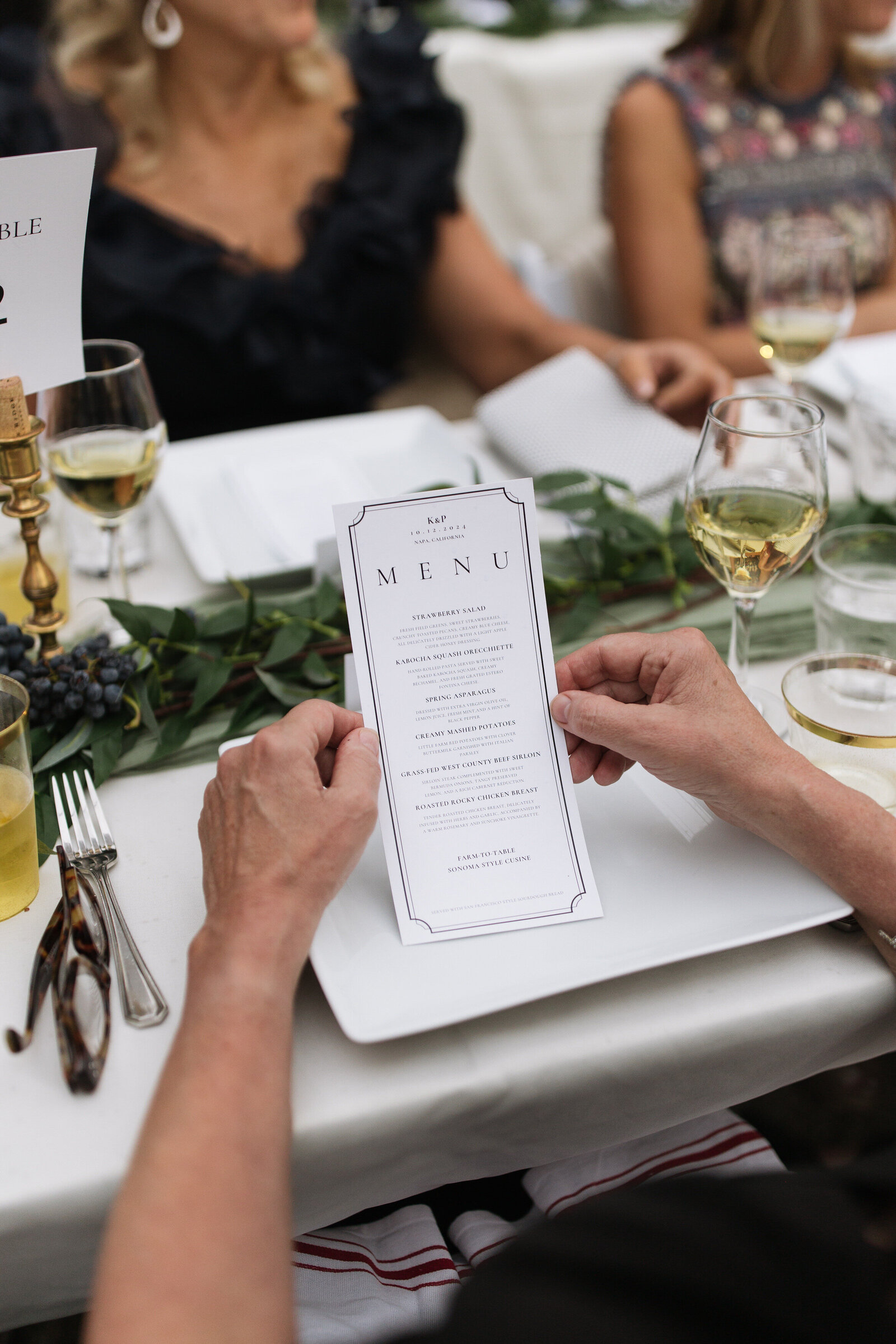 Guest browsing dinner menu at intimate Washington wedding reception