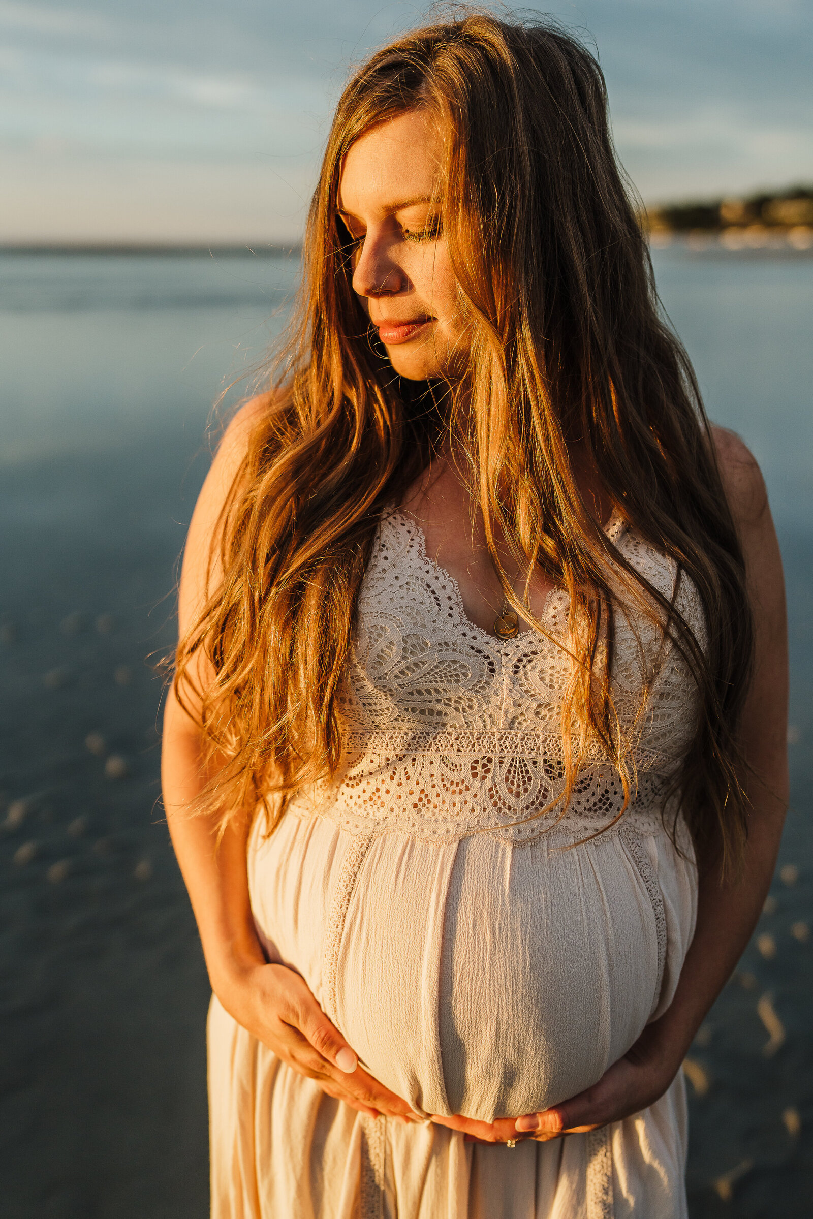 pregnant woman at ocean in massachusetts