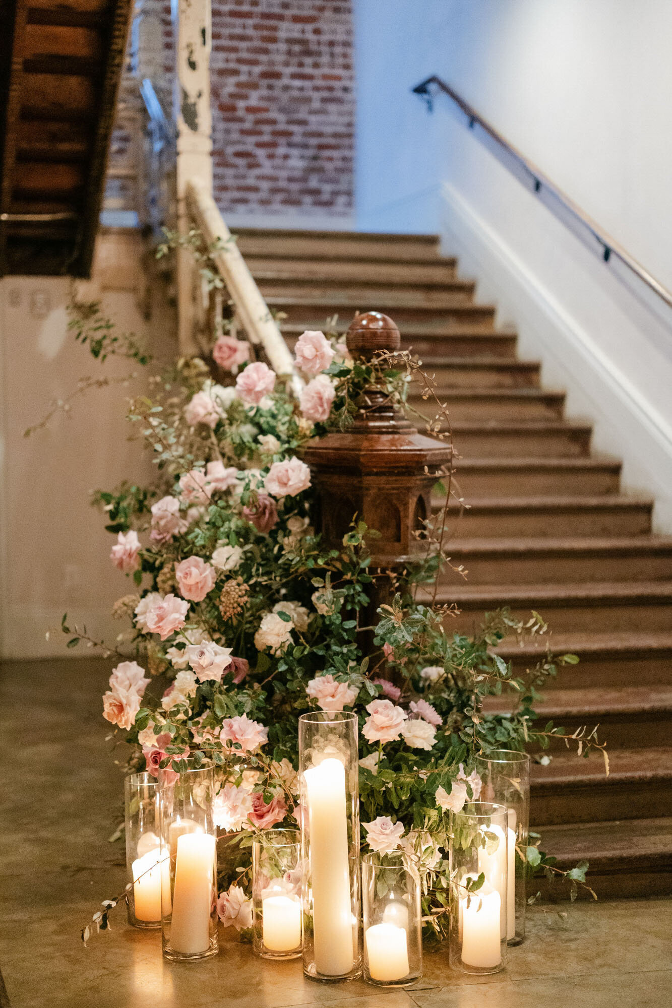 staircase with florals and candles