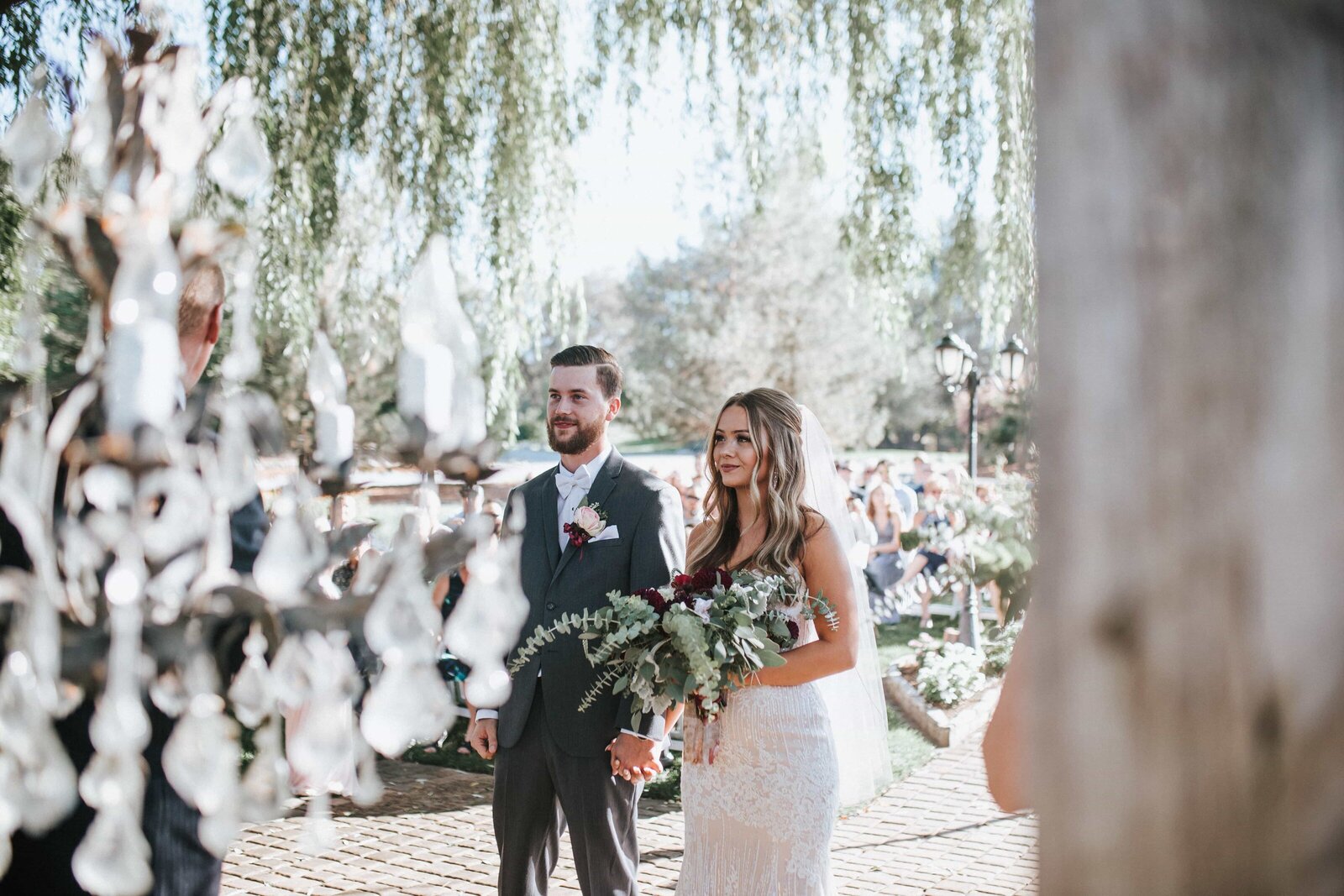 Sacramento Wedding Photographer captures bride and groom at alter during intimate wedding ceremony