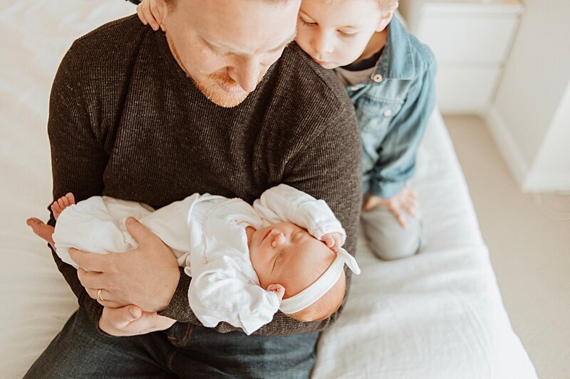 Dad and brother with baby at a Vancouver newborn photography session