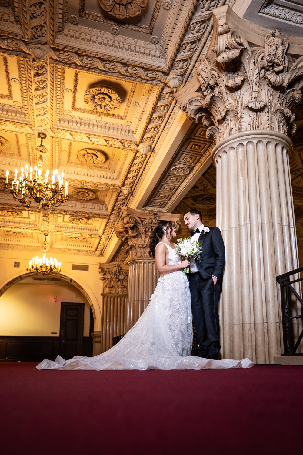 Dramatic low-angle photo of bride and groom at Capital on Baronne in New Orleans