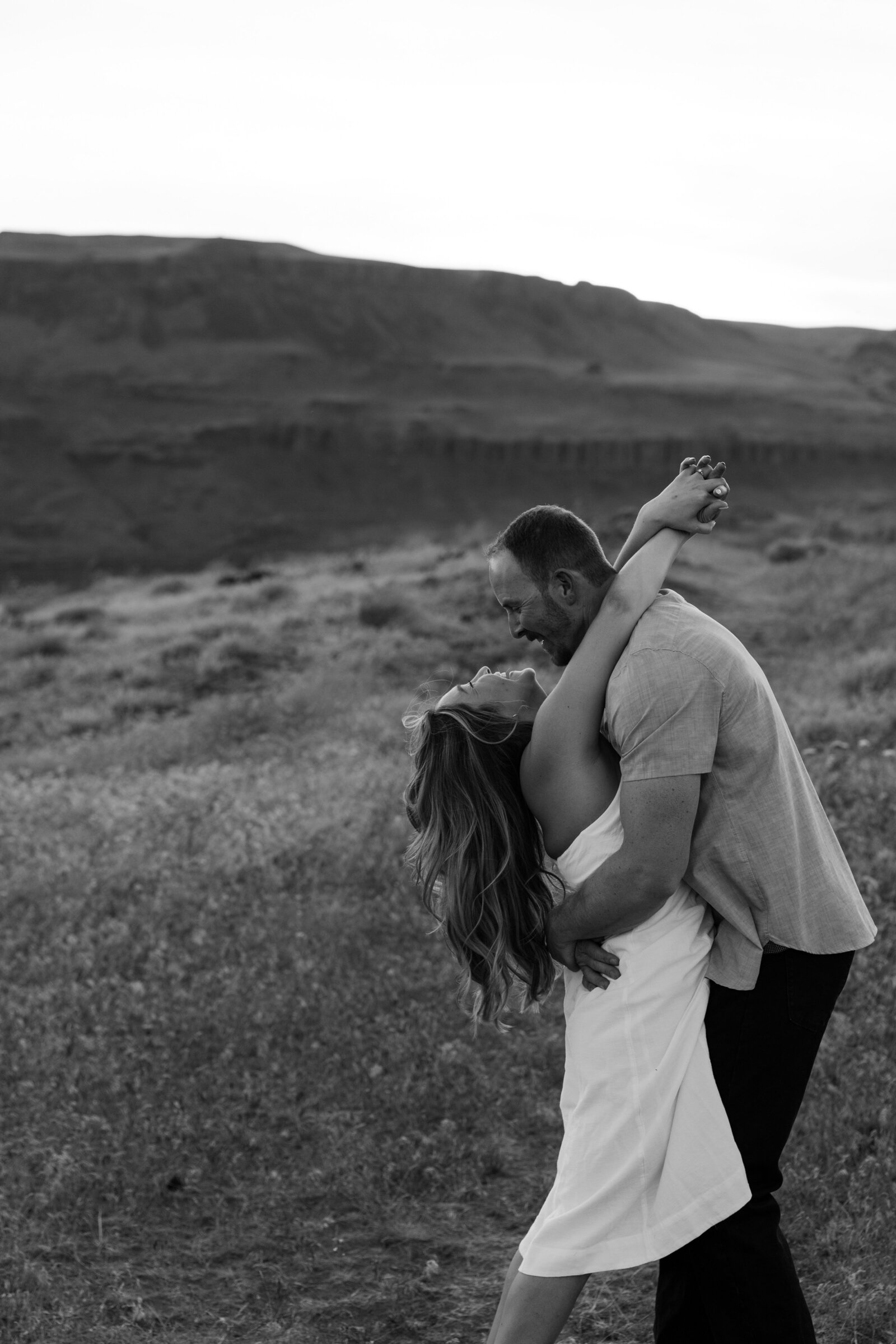 Couple dancing around in Washington for their engagement photos