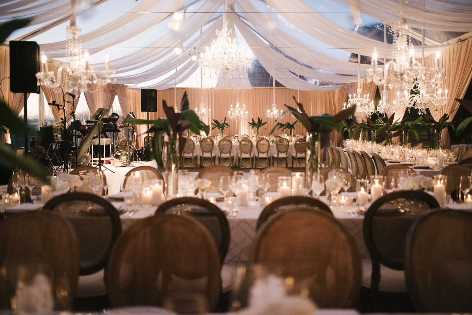 Luxury wedding layout with botanical centerpieces and chandeliers