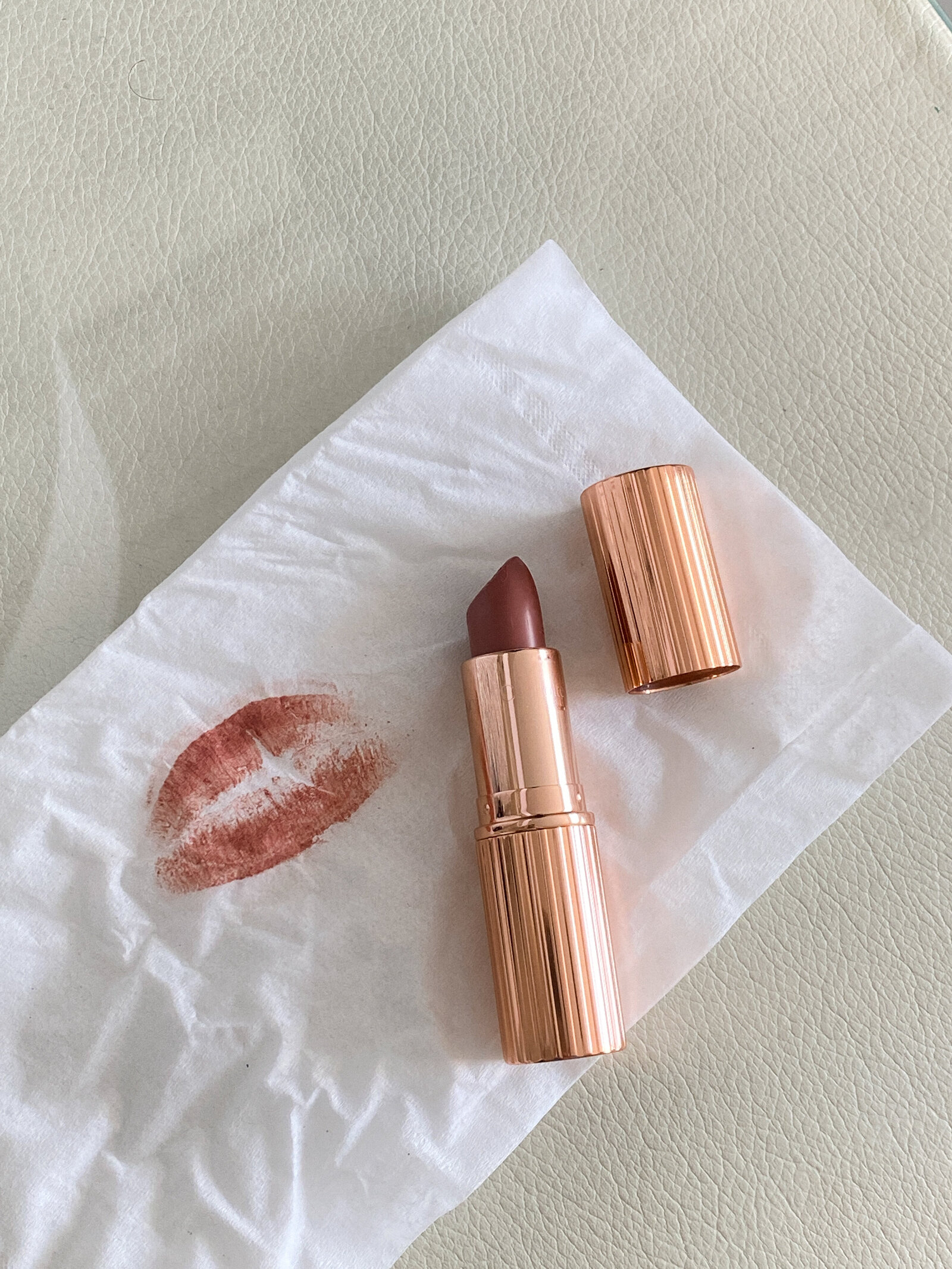 charlotte tilbury lipstick, lipstick shaes, lipstick kiss on napkin, lipstick kiss on tissue, gold lipstick tube, aesthetic product photography, UGC, user generated content, dc bloggers, washington dc content creator