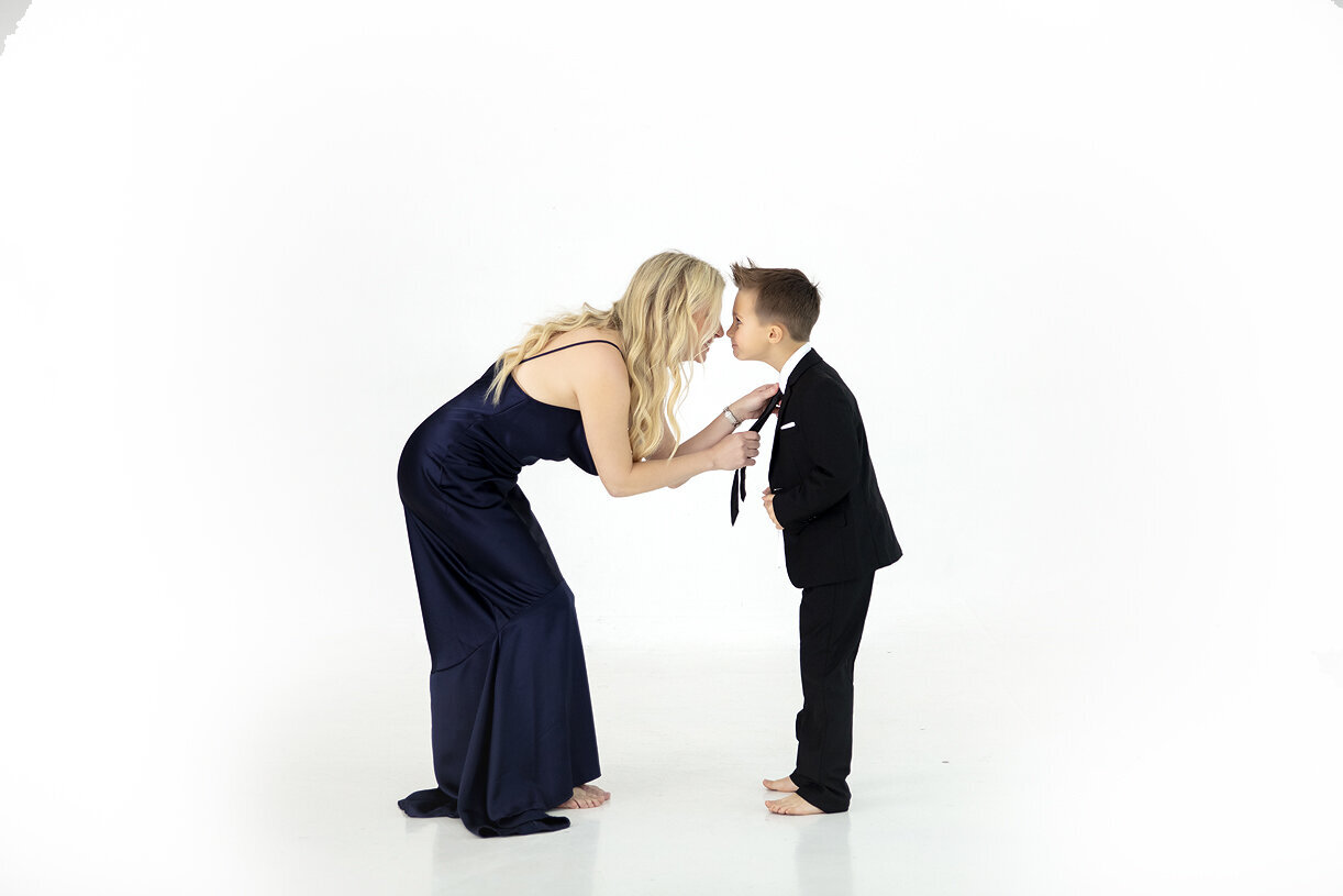 Mother and son dancing at Lumen Room Plano white studio.