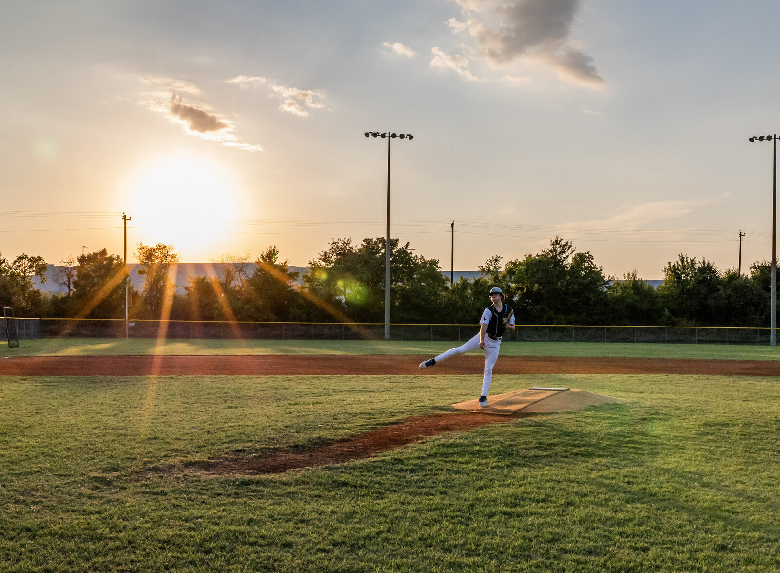 boy pitching baseball