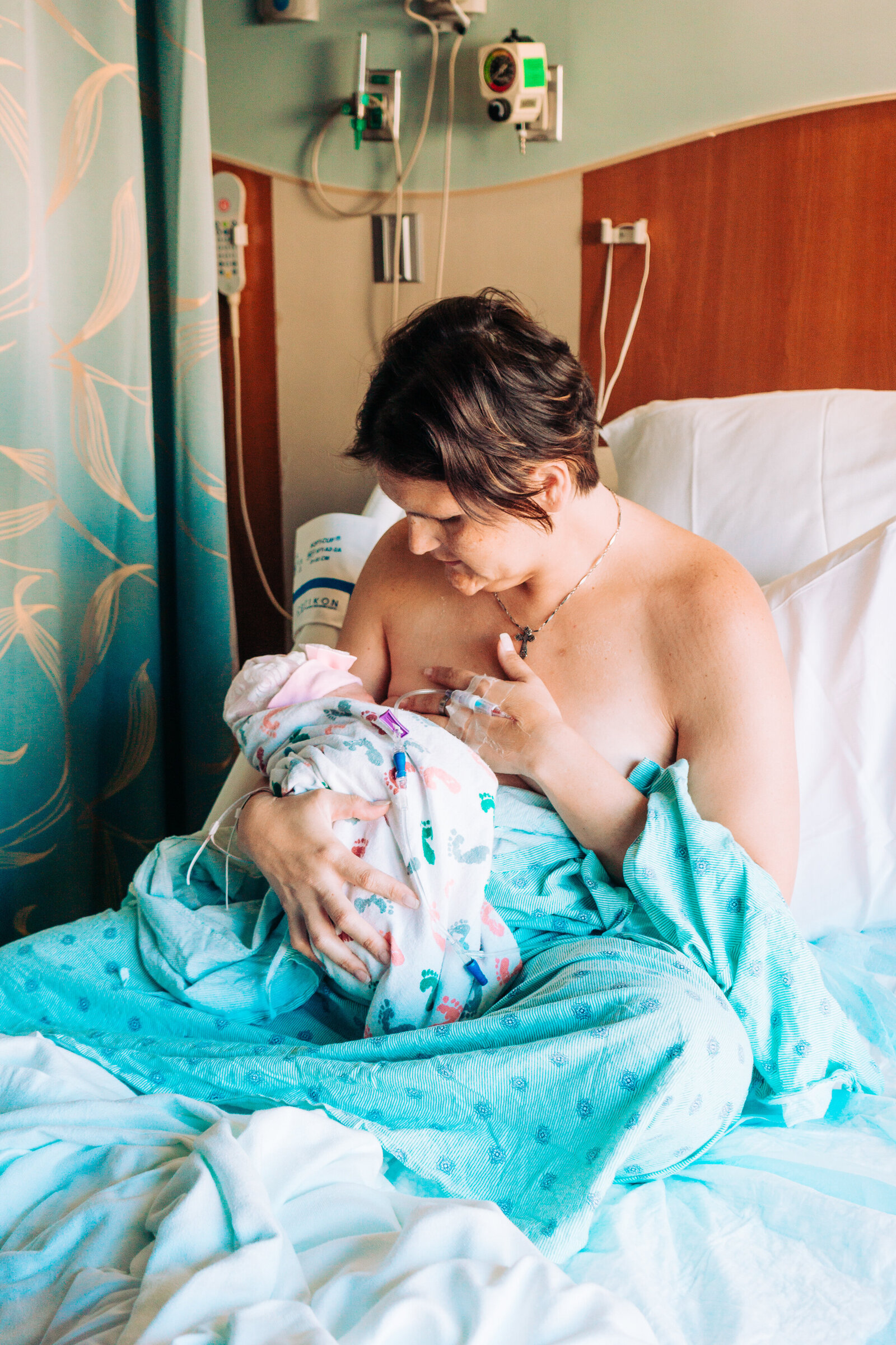 Mom breastfeeding her baby after birth in Boynton Beac, FL